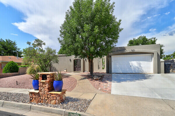 Public Remarks: Welcome to Bear Canyon! This stunning property located at 6400 Torreon Dr NE in Albuquerque offers the perfect blend of modern luxury and serene natural beauty. Step inside this spacious 3-bedroom, 2-bathroom home and be greeted by an abundance of natural light and open living spaces. The recently remodeled kitchen features stainless steel appliances, granite countertops, and huge center island, perfect for family or entertaining guests. Relax in the luxurious master suite with a spa-like ensuite bathroom and walk-in closet. The two additional bedrooms offer plenty of space for guests or a home office. Outside, the expansive .33-acre lot provides ample room for outdoor activities and gardening,