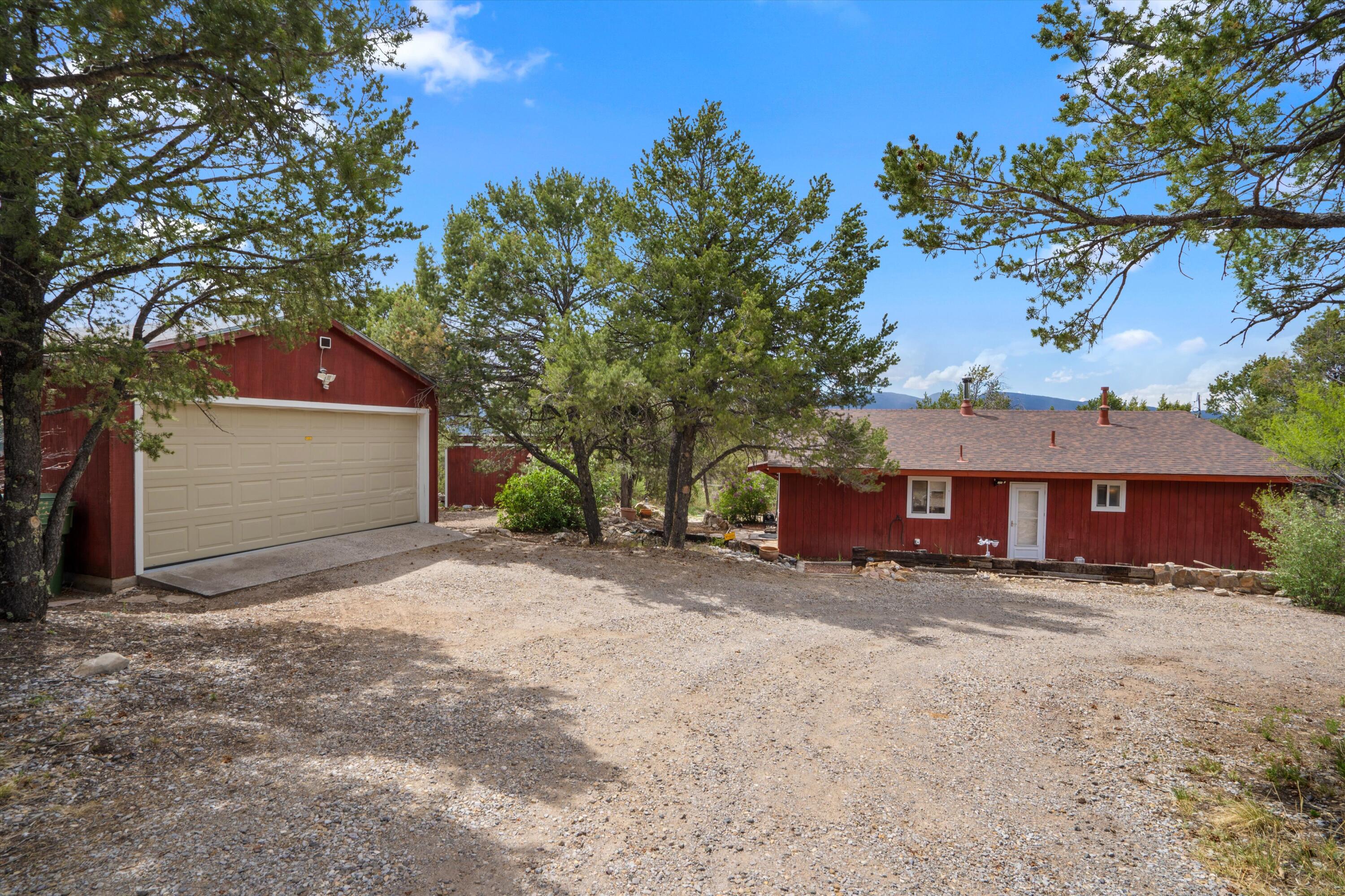 Escape to your private mountain retreat in the picturesque Tijeras Mountains! This stunning property offers breathtaking panoramic views that will greet you every morning and paint unforgettable sunsets each evening. Imagine unwinding on your deck, surrounded by nature's beauty and the tranquility of mountain living. The natural light, and seamless indoor-outdoor flow that makes this home an absolute sanctuary. Don't miss out, Many fresh updates and renovations will allow you to immerse yourself in this mountain paradise!