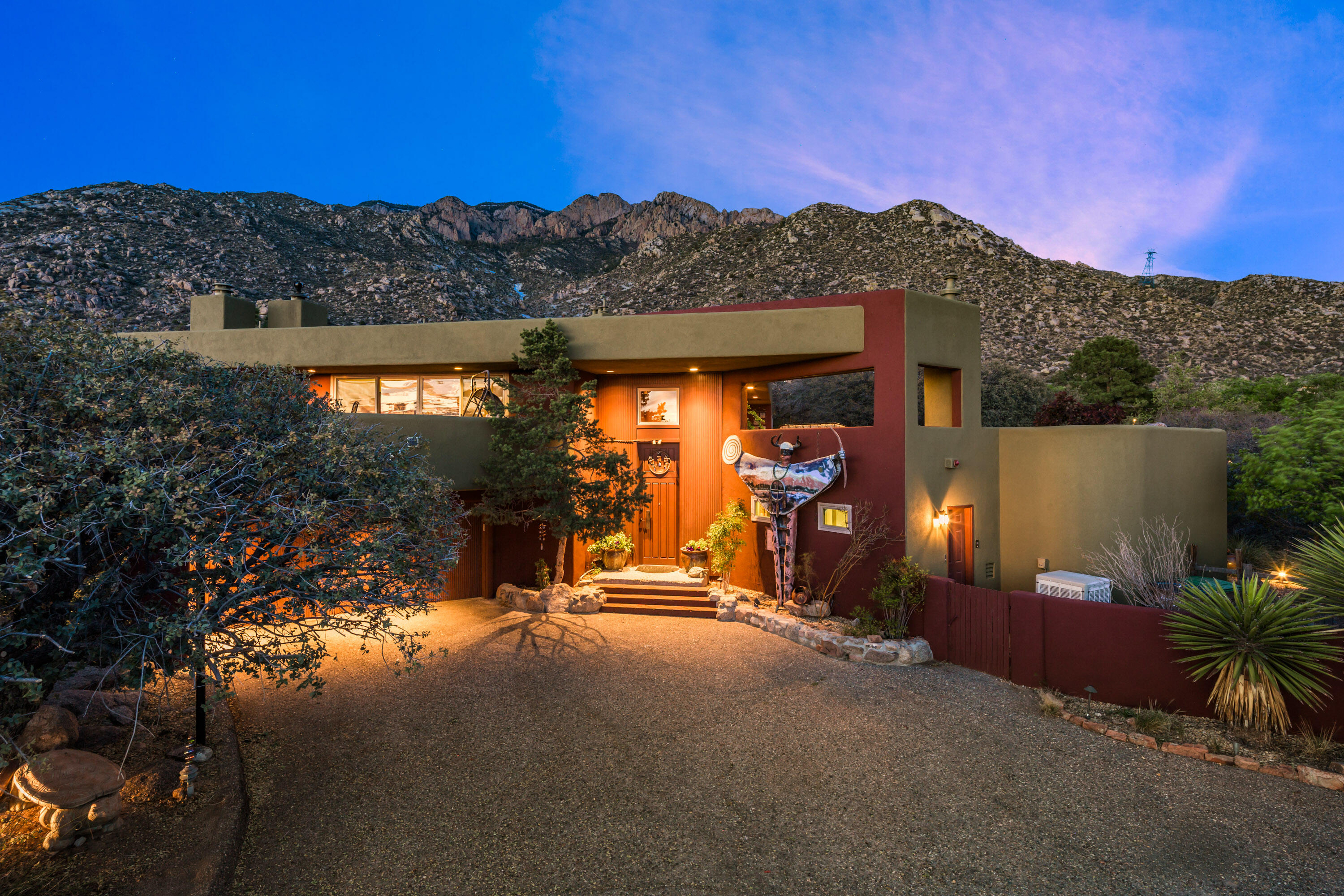 Open house 5/11 1 -3pm. Absolutely breathtaking SANDIA HEIGHTS home with architectural detail & charming character throughout. Situated on a .93 acre lot offering PHENOMENAL 360 VIEWS and stunning outdoor spaces. This home features 3/4 bedrooms,4 baths, 3 living areas,( the family room complete with a Murphy bed) & formal dining. The island kitchen offers granite/corian countertops, Sub-Zero refrigerator, and abundant storage. The primary suite includes VIEWS, pellet stove, large walk-in closet, and luxurious bath. Very generous sized secondary bedrooms. 2-car garage w/storage & 220V outlets. Enjoy Brazilian hardwood decking (wired for a hot tub), 4 fireplaces, hardwood floors upstairs, recent stucco (2023) & tankless water heater. A true showplace nestled beneath the Sandias!