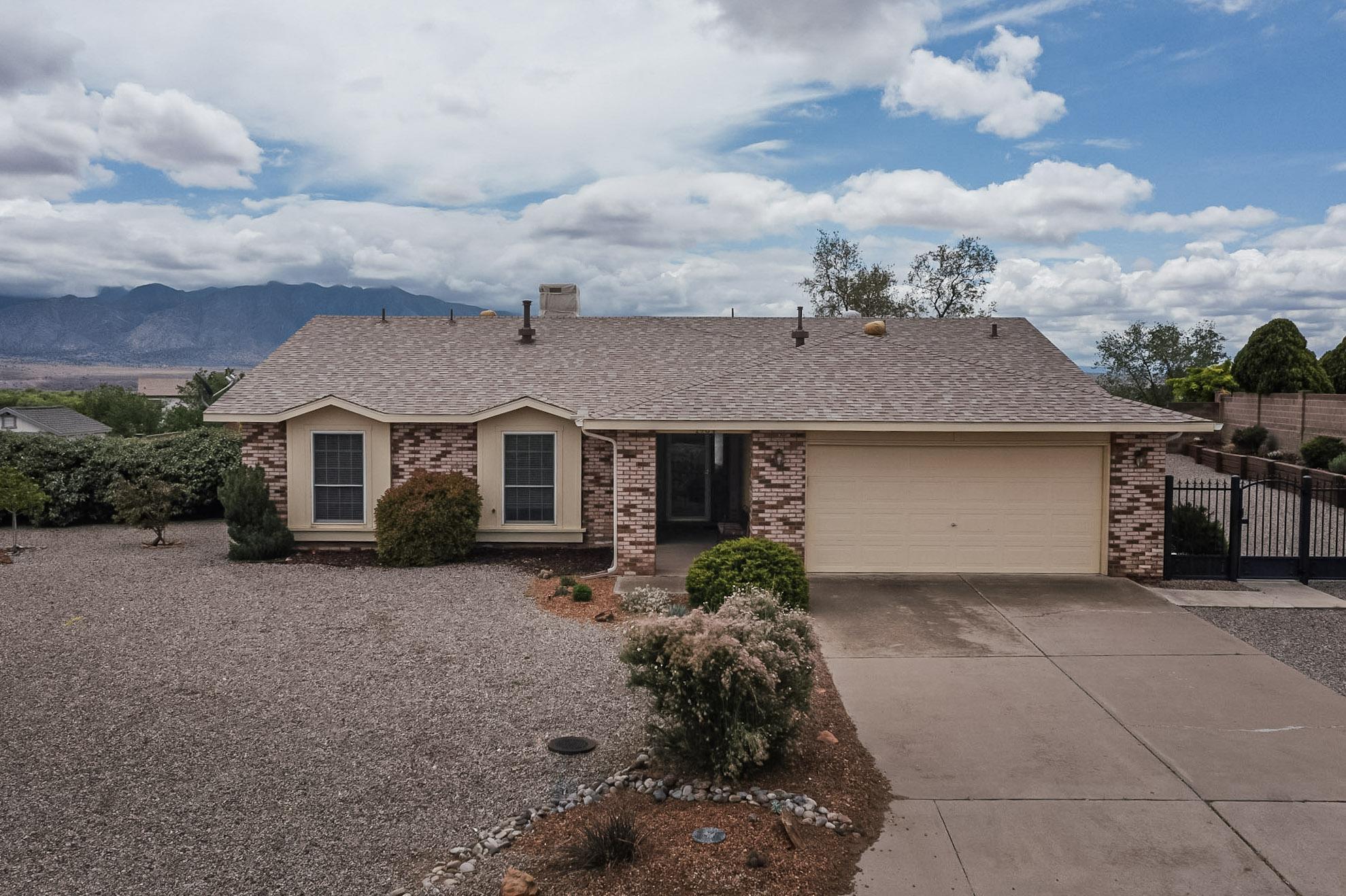 Welcome to your new dream home in Enchanted Hills! This stunning property features an oversized lot with backyard access possibilities, making it perfect for entertaining family and friends while enjoying the unobstructed views of the majestic Sandia Mountains. With a move-in ready condition and a highly functional layout, this home has been meticulously maintained, ensuring comfort and ample space in every corner. No Poly Pipes & New Roof! The spacious living areas boast raised ceilings that allow for plenty of natural light, inviting relaxation and gatherings. Additionally, the beautifully landscaped yard and large covered patio offers endless opportunities for outdoor fun. Don't miss your chance to own this exceptional home, where breathtaking views and tranquility and value await!
