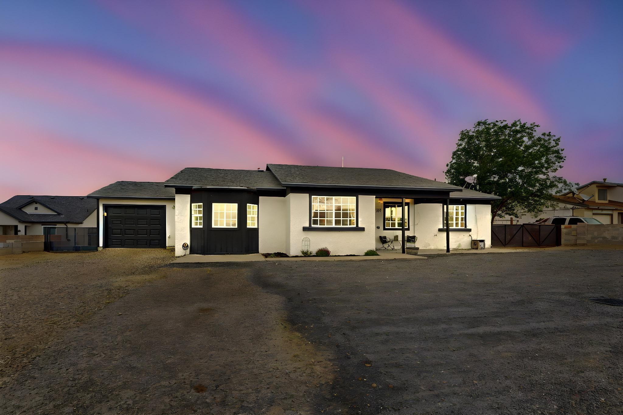 Charming Rio Rancho beauty with tons of upgrades. 4 bedrooms with 2 primary suites 3 bath 1 car garage on .25-acre lot.  This home offers beautiful granite counter tops in the kitchen and bathrooms; has lots of character, a unique layout with ample space, and boasts lots of natural light. Spacious laundry room with plenty of storage and a workshop area in garage connected to the perfect at home office space! Are you looking for BACKYARD ACCESS for all your toys, NO POLY PIPES and NO HOA!! Then this is the home for you! Close to Rainbow Park with beautiful pool for hot summer days, play area, dog run, schools, shopping centers and everything else you need! Move in ready and a great place to call HOME! Come take a look before this one of a kind home is gone.