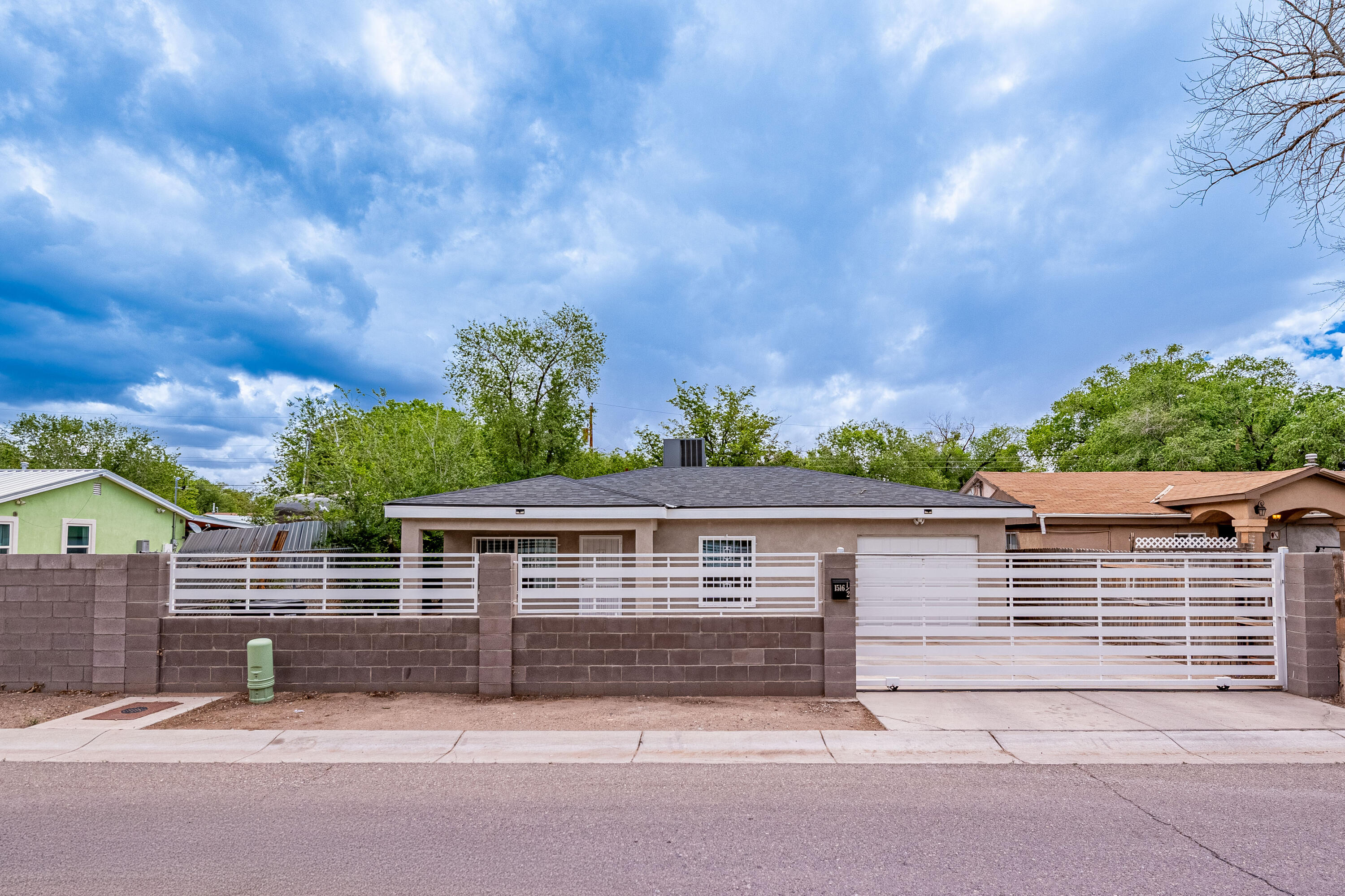 Welcome to 1516 Gallegos Rd SW - a charming home offering modern comforts and a private setting. Featuring a one-car garage, refrigerated air, and essential appliances including a refrigerator, oven, microwave, washer, and dryer, this home is move-in ready. Enjoy new carpet in the bedrooms and easy-care laminate flooring throughout the rest of the home. The gated front and fully walled backyard provide added privacy and security. Don't miss this opportunity - schedule your showing today!