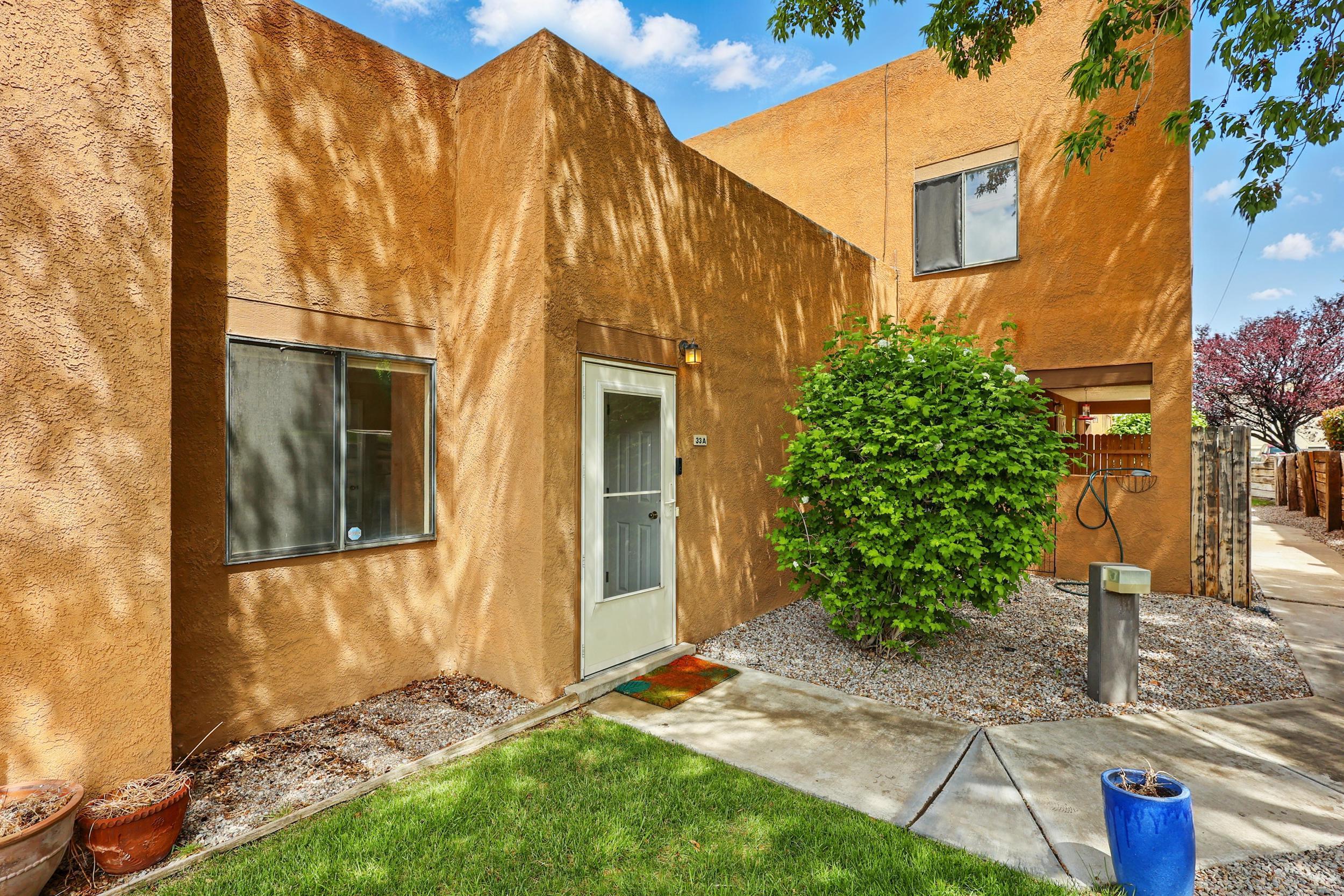 Nestled at the base of the majestic Sandia Mountains & backing up to open space, this beautifully updated condo offers a low-maintenance lifestyle in one of the most desirable areas of the FOOTHILLS! Gorgeous updated tile floors & beautiful crown molding throughout, you will surely be impressed. Once you walk into the living room you notice a great backdrop of the mountains. The heart of this home is the oversized living room with tons of natural light, updated kitchen with all new stainless steel appliances. Charming woodburning fireplace in living area and your own private, and fenced in back porch with views of the foothills. Primary bdrm offers a fabulous updated bath. 1 car garage. Awesome location steps from hiking/biking trails, I-40, Sandia Labs & KAFB. You dont want to miss out!!