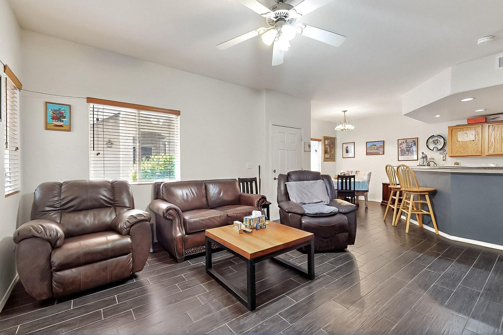 Welcome to this desirable first-floor condo located in the sought-after Rancho Mirage community. Enjoy a bright and open floor plan filled with natural light and offering lovely views of the sparkling pool just steps from your patio.This inviting home is part of a well-maintained community that features two refreshing swimming pools, a welcoming clubhouse, a  fitness center, scenic parks, fun playgrounds, and miles of walking and biking trails. Perfectly situated with easy access to I-25 and Paseo del Norte, you're just minutes away from shopping, dining, and everything Albuquerque has to offer. Don't miss this opportunity to enjoy comfort, convenience, and resort-style amenities all in one place!