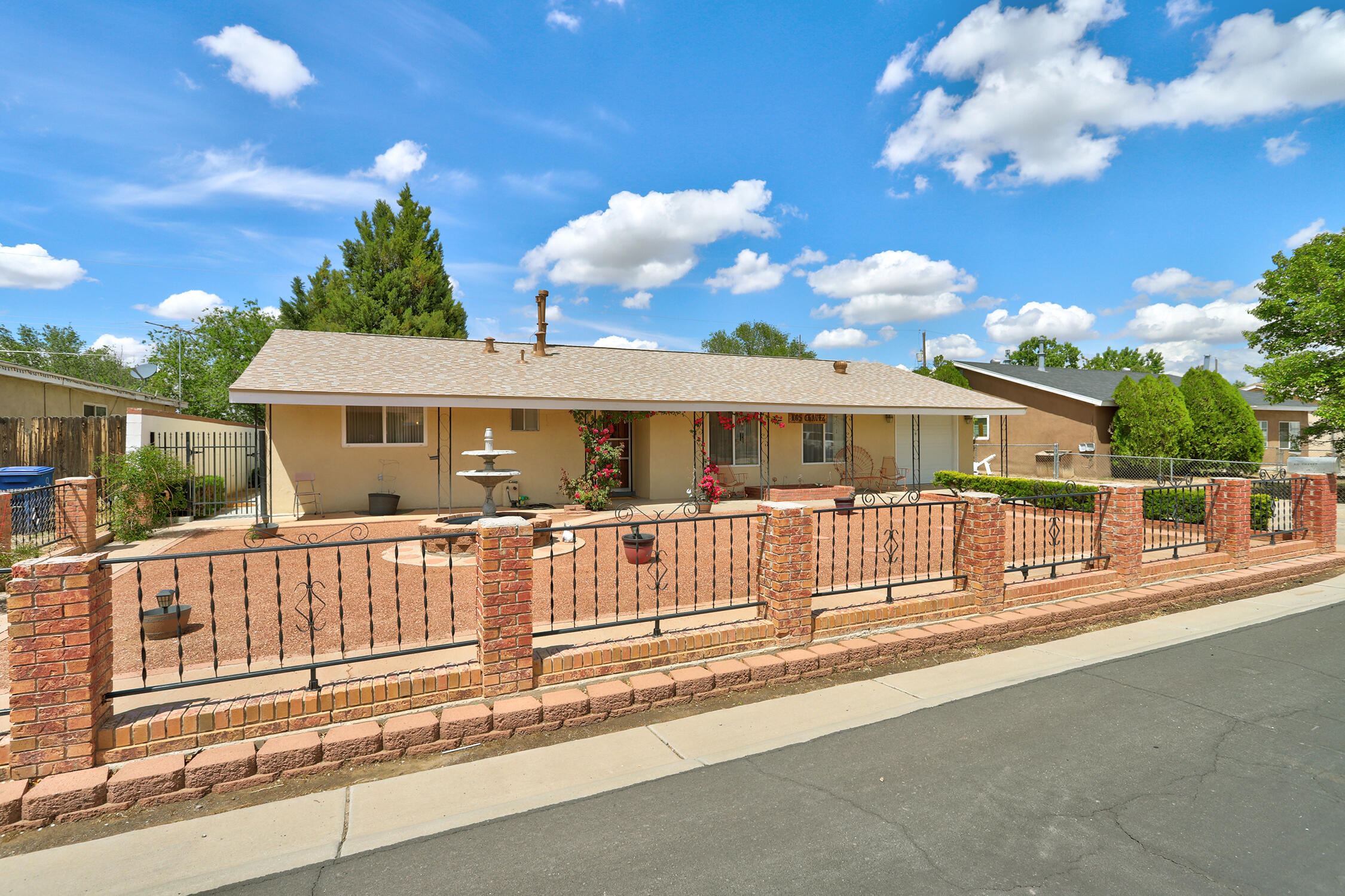 Charming 4 bed, 2 bath ranch-style home with plenty of space inside and out! Features include a 1-car garage plus 3 covered carport spaces--perfect for vehicles, RVs, or toys. Enjoy the expansive covered back patio, ideal for entertaining or relaxing, overlooking a lush lawn with its own irrigation well. This home offers comfort, convenience, and outdoor living at its best. Don't miss out!