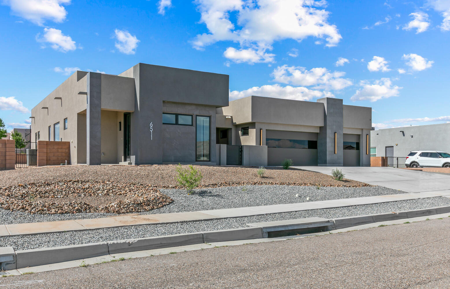 Newly constructed luxury home with all the modern touches you've been looking for.  This beautiful home is full of unique textures and features. Sitting on over &#8531; of an acre this single story property is nestled in beautiful Petroglyph Estates in Volcano Cliffs. The open floor plan is perfect for entertaining, or settling in w/ the family. Huge waterfall island in an incredibly appointed kitchen is a wonderful gathering spot. Viking appliances await your family chef. Elegant glass door pantry for your special wine pairings just off of the dining room. Open living space has accordion glass doors onto the large patio.  Dining & primary bedrooms also have these great portals to outdoor living. En suite bathroom is spa like with gorgeous amenities. Att'd casita w 3/4 bath. Divine ameniti