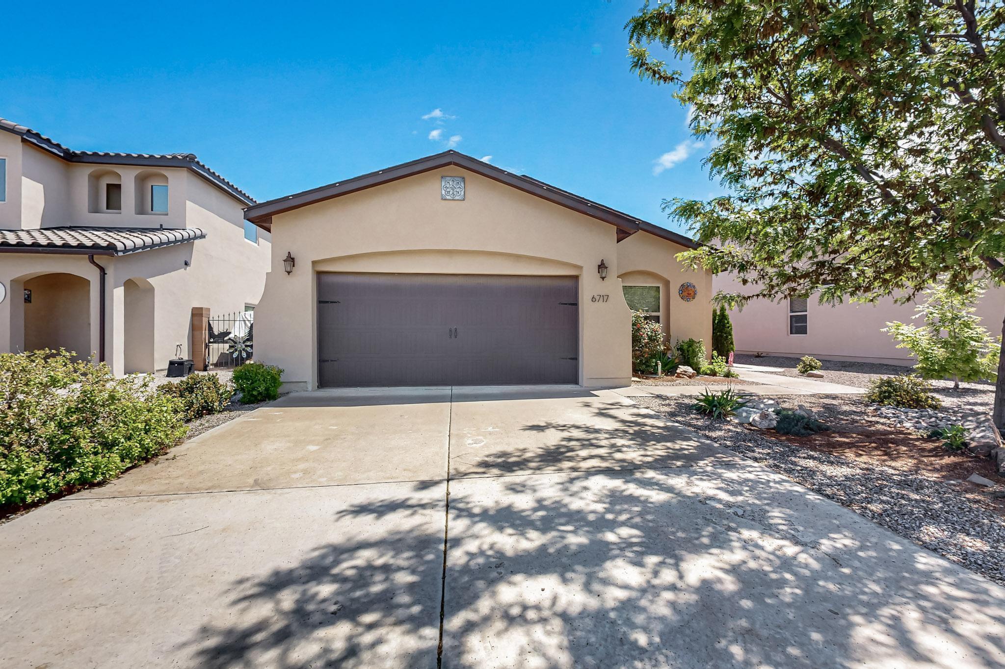 Welcome to this beautifully maintained single level 3-bed, 2-bathroom Abrazo Home, offering modern comfort and style. Fresh interior paint and elegant tile plank flooring flow throughout the home, creating a clean, contemporary look. The open-concept kitchen is perfect for entertaining, featuring a granite countertop bar, gas range, dishwasher, refrigerator, and a spacious walk-in pantry. The primary suite is a serene retreat with abundant natural light and a generous walk-in closet plus a dual vanity sink. Step outside to your private covered patio and enjoy a fully landscaped backyard -- ideal for relaxing or entertaining. Plus, residents have access to a nearby neighborhood park just minutes away, offering addition additional space to unwind and play.Call today to schedule your showing!
