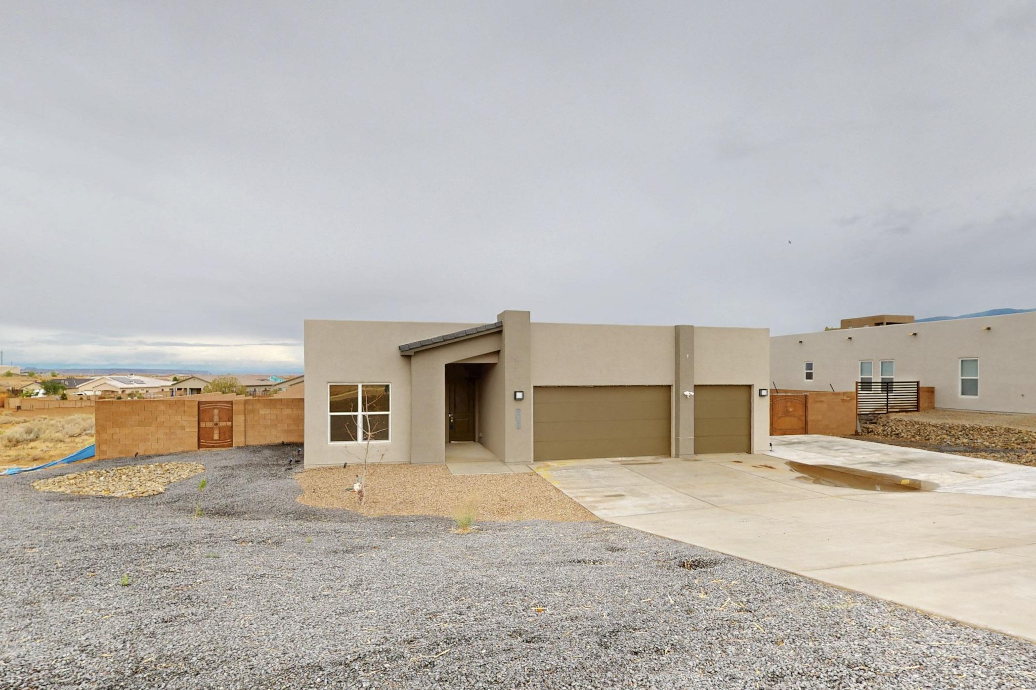 Step into the comfort of this nearly new (2023) Westway home in the sought-after Vista Entrada neighborhood in Rio Rancho.  Entertain guests in the open living area while cooking up a masterpiece in the Bosch equipped kitchen with level 5 Silestone countertops and upscale cabinets.  Set on a generous .62-acre lot, you have space to breathe, enjoy outside, and relax while watching the mountain views. The 3-car garage (wired for EV's) gives you ample space to store your toys, cars, or convert a bay into a workshop. Go through the custom metal gate for backyard vehicle access to help make the back how you envision. Walls have been raised so you have even more privacy. Schedule a showing so you can decide to make this modern home and floor plan yours.