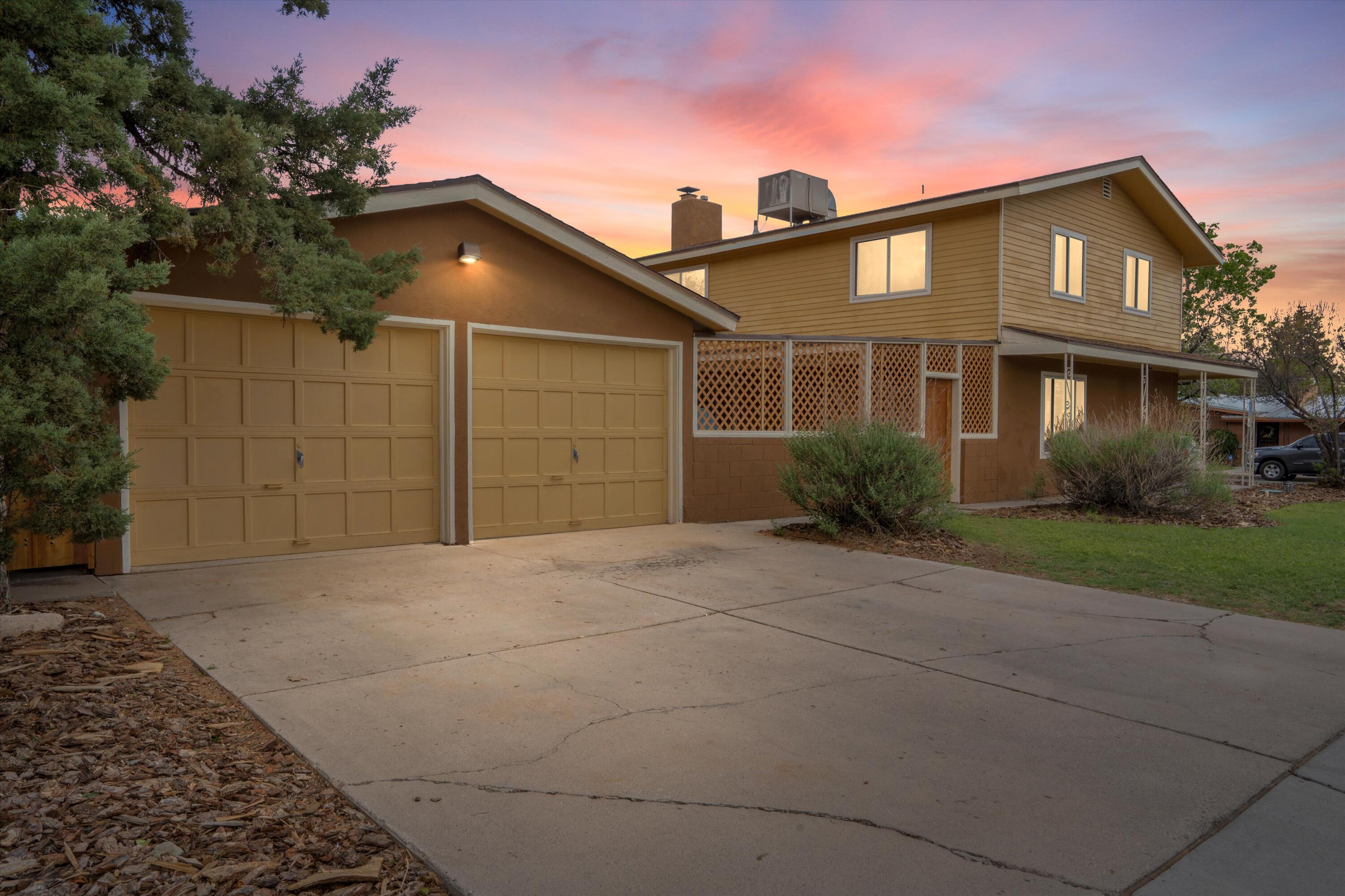 Discover this 6-bedroom, 2-bath, 2-story gem in the Nob Hill/UNM area! Enjoy a spacious kitchen with custom wood counters, a built-in bar, and more. The main-level primary suite features a walk-in closet, dressing area, bathroom access, and privacy. There is room for it all with five upstairs bedrooms. Love your home with updated bathrooms and charming hardwood floors. Enjoy your delightful deck, abundant storage, finished basement, 2-car garage, ample light from large double-pane windows, and beautifully landscaped back and front yards with drought-resistant grass and sprinklers, as well as a drip irrigation system. Don't settle; be near it all and have space, too!
