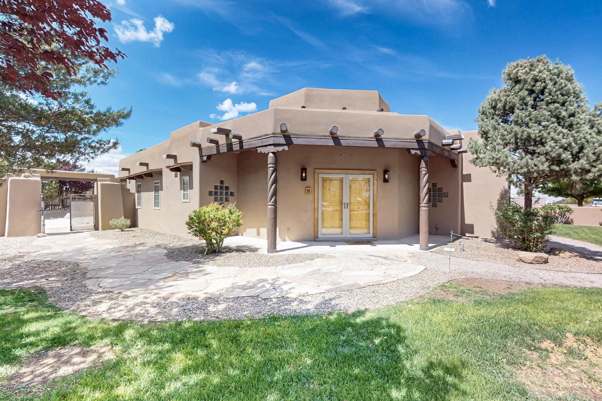 Beautifully maintained property in horse zoned area. Mountain and City View .75 acre lot includes space for Casita as well as RV/Boat parking for Adventure Enthusiasts. (3-car w/220)Perfect home for entertaining with magnificently landscaped yards, flowers, mature blooming trees, cactus, paver patios and Ramada. Dual en suites for extended family/guests and design affords courtyard egress for private hot tub retreat. Open and airy prestigious southwest accents inside home with 3 gas kivas (replaced & resurfaced), vigas, tongue & groove, corbels, beams, pillars, portals w/vigas, latilla work and more. 2 Bedrooms share Full Bath.  Elegant quartz waterfall kitchen counters, solid wood cabinets, tile flooring, skylights, stacked quartz backsplash, apron sink w/touch sensitive faucet!