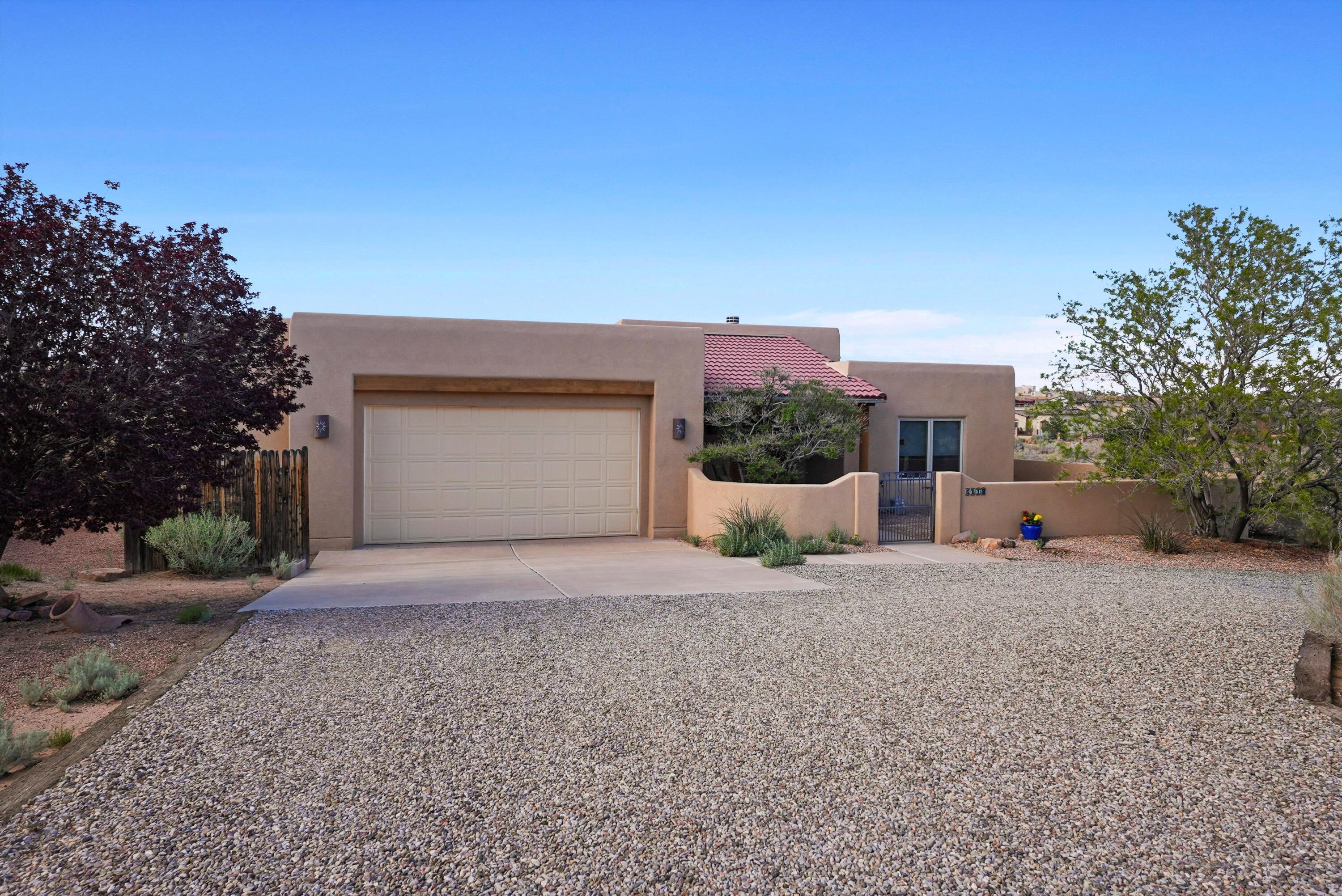 With mountain views and relaxing outdoor spaces, this well-built custom home is located in a quiet neighborhood just ten minutes from groceries, shopping and restaurants. The open concept living, dining, and kitchen areas are great for entertaining, and three covered patios extend the sense of space and serenity. The large primary bedroom features excellent mountain views, as well as an entrance to one of the covered patios equipped with 220 power for sauna or hot tub. An ensuite bathroom includes a custom tiled double shower and large walk-in closet. For privacy, two additional bedrooms and a full bath are on the other side of the house. An office, half bath, and laundry room round out the rest of the living space. The attached two and a half car garage provides easy access to the