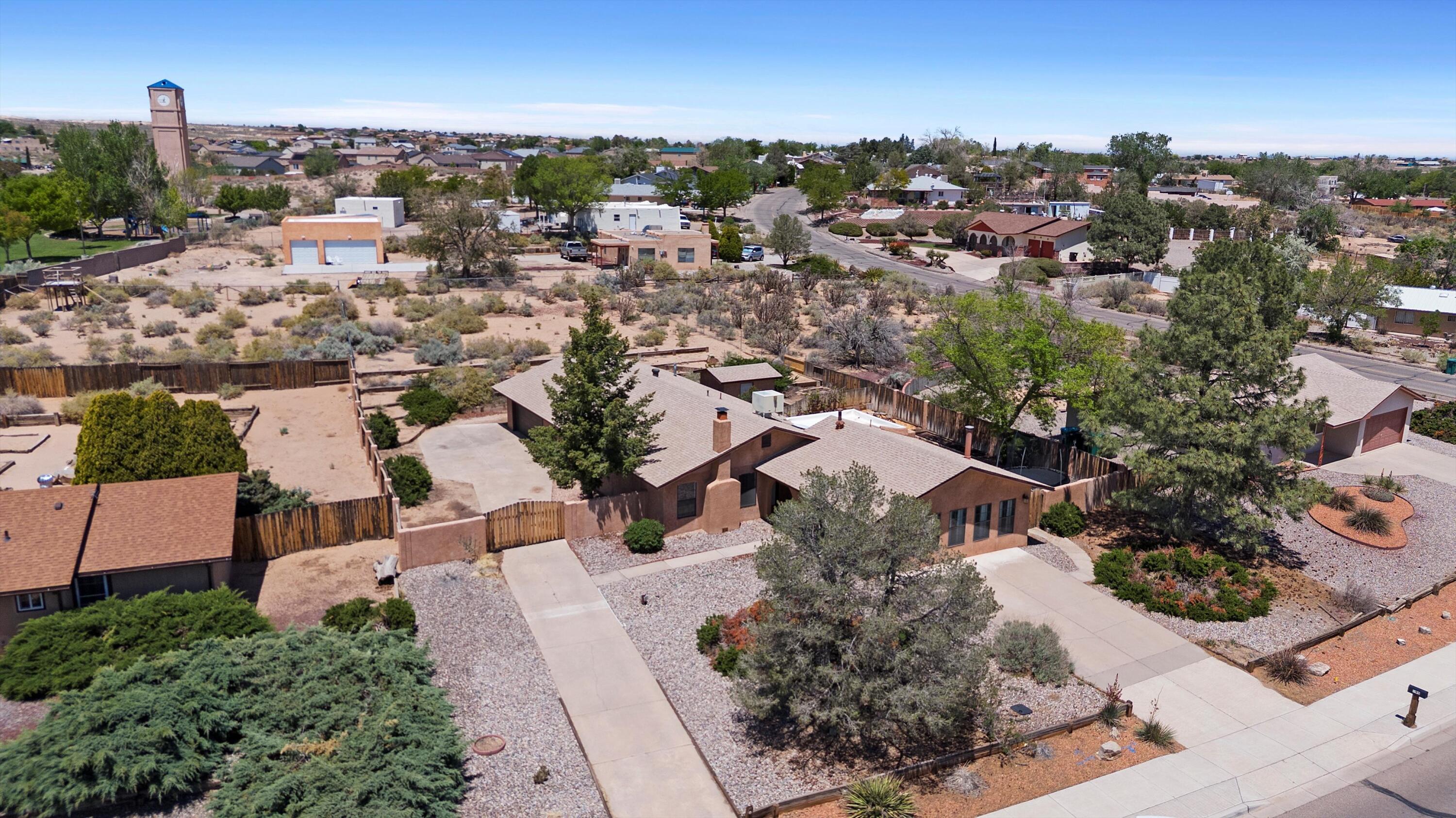Welcome to 495 Lisbon SE, nestled in the heart of Rio Rancho! Love GIANT GARAGE SPACE? This home delivers with nearly 700 square feet (3 car tandem) --perfect for cars, toys, tools, or your next project. You'll also enjoy ample side parking and an extra front driveway for added convenience. Inside, this spacious single-story home offers 3 bedrooms, 2 bathrooms, a cozy sunken living room, separate dining area, and a huge family room--formerly used as a man cave, but with limitless potential to fit your lifestyle. Step outside to find a large backyard, a generous gardening shed, and the crown jewel: unobstructed, million-dollar mountain views from the entire front of the property. It's a must-see! Don't miss this rare find--call your Realtor today to schedule a showing!