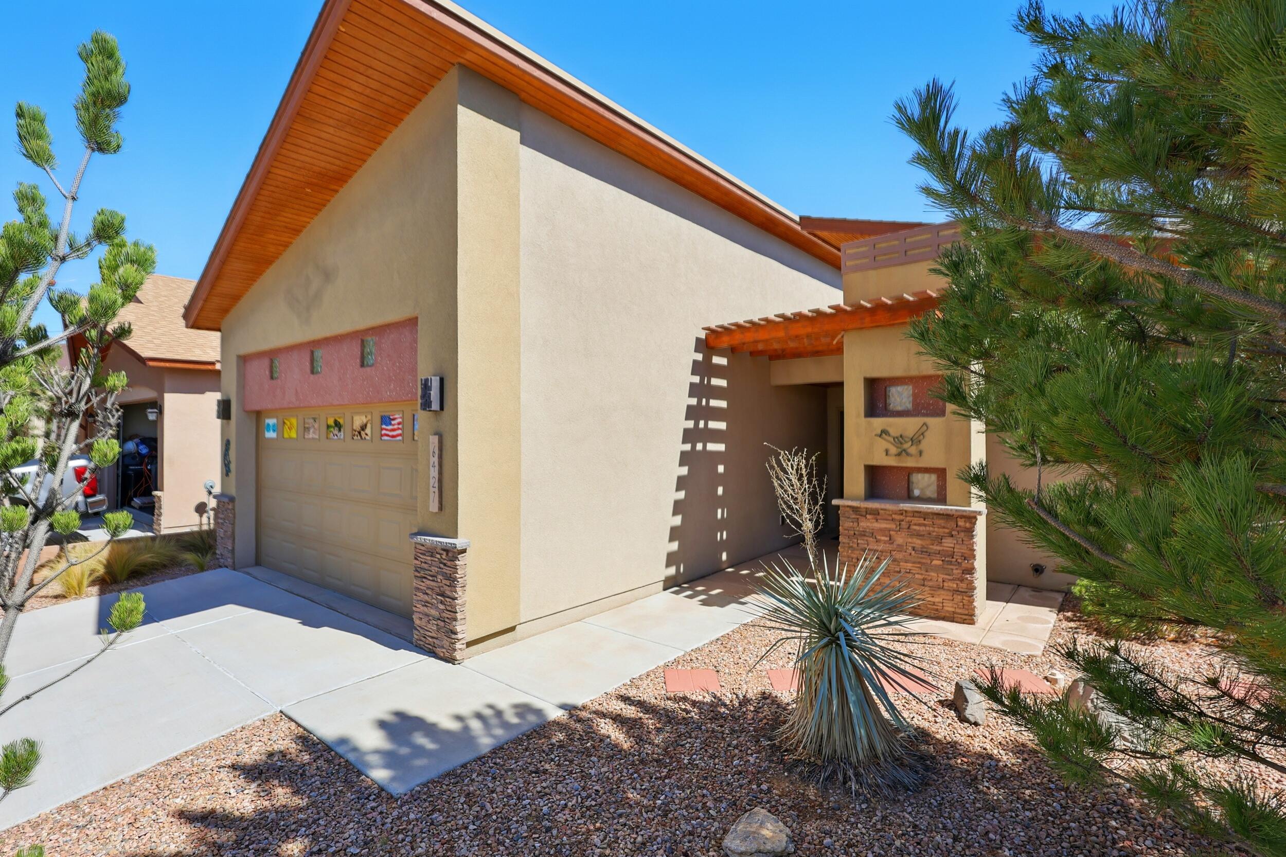 Beautiful Paul Allen Green-Built Home in the Saltillo Neighborhood! Experience modern comfort and energy efficiency in this immaculate single-story home, ideally located on Albuquerque's rapidly growing west side. Meticulously maintained by the owner, this home boasts exceptional curb appeal with low-maintenance front and back yards. The oversized two-car garage features extensive storage, including a fully floored attic with easy access. This home is truly energy-smart with an owned 13 panel solar system, GOLD-level Green Built Certification, a 49 HERS Index, high R-value insulation, low-E windows, and a tankless water heater--offering year-round comfort and exceptionally low utility costs.  It is conveniently located near shopping, dining, entertainment, medical facilities, and more.