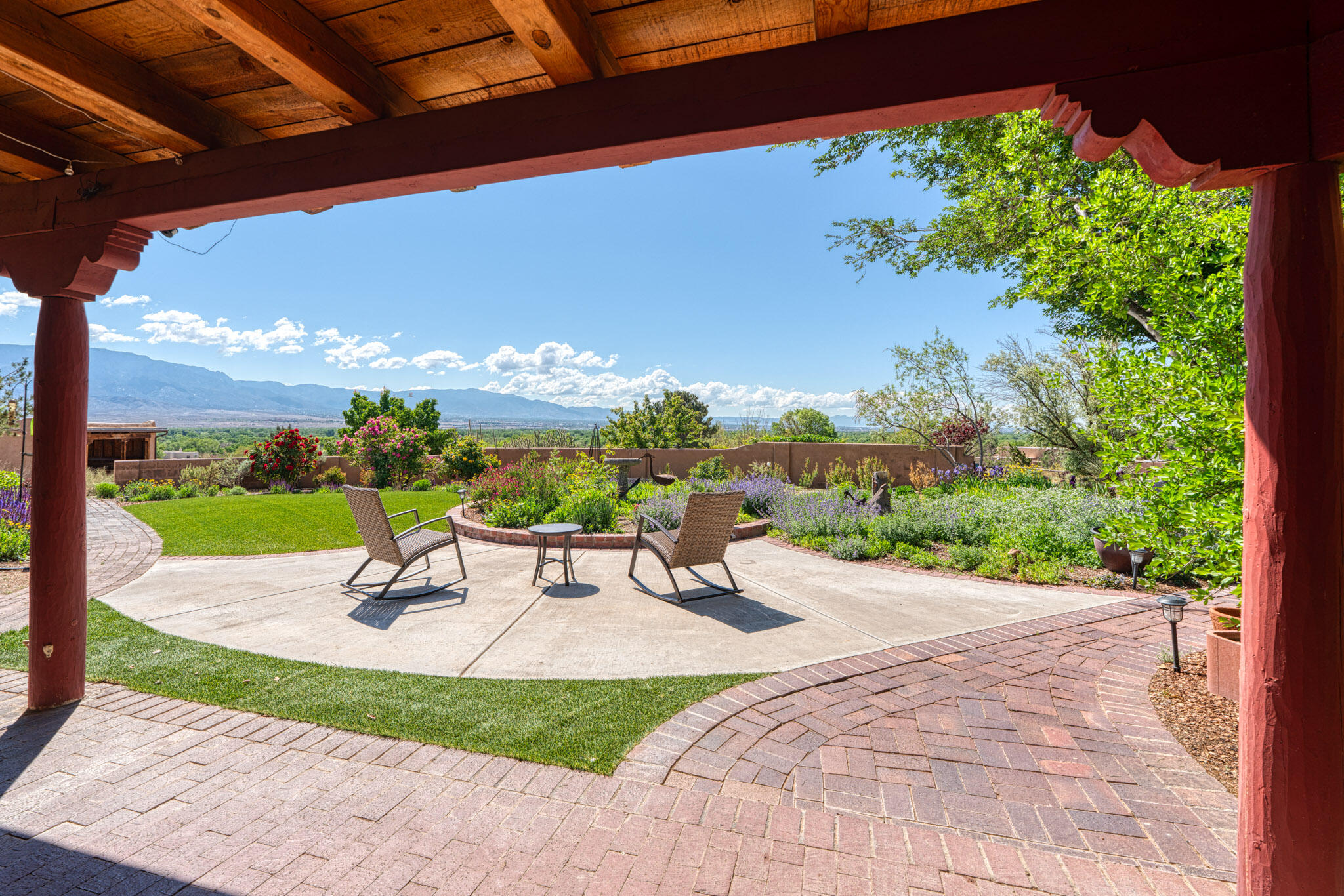 Riveting Panoramic Mountain / Rio Grande Green Belt VIEWS! Character Laden Classic Sante Fe style Immaculate condition beauty with adobe accent walls, brick floors, wood beamed 15' Great Room Ceiling, clerestory windows, 2 Classic Kivas, hand crafted wood beamed ceilings in Living Room, Owners Suite, Portal. Masterfully Sited! Provides sweeping views thru many large windows from main living spaces. Lovely open Chef's Kitchen with bar and big dining room. Owner's Suite 3/4 ensuite bath, walk-in closet, door to patio. Seamless indoor outdoor flow. Stunning Perennial Gardens! Barn + finished Studio and paddock. Corrales 'Safest City,' In Town Country, NM Horse Capitol, Voted 20 Best Places to Live, Trails, Bistros, Brews. ROAD CLOSURE SO 1ST SHOWINGS 1/17, 1-8p