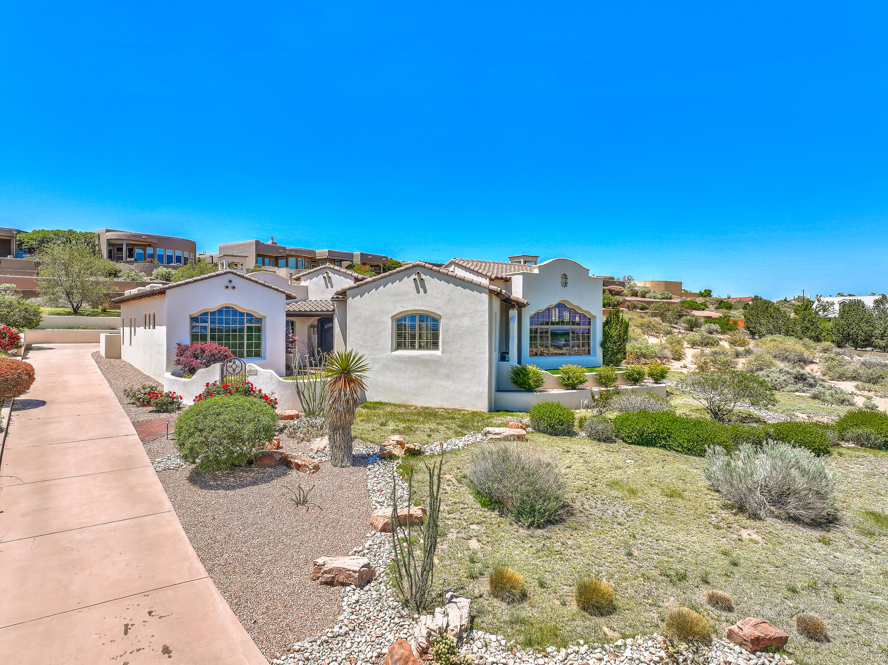 **Oxbow Bluff Tuscan/Pueblo Masterpiece!**This stunning 3,850 sq. ft., single-story, 4-bedroom, 3-car garage home is a true work of art, built with precision, elegance, and exceptional craftsmanship. Every detail has been meticulously designed, showcasing the pride of homeownership--it's as if it has never been lived in!  Custom-built in 2009, this exquisite property sits on a generous .47-acre lot, offering breathtaking views of the Rio Grande River, sparkling city lights, and the iconic Sandia Mountains. Priced to sell--don't miss this incredible opportunity!