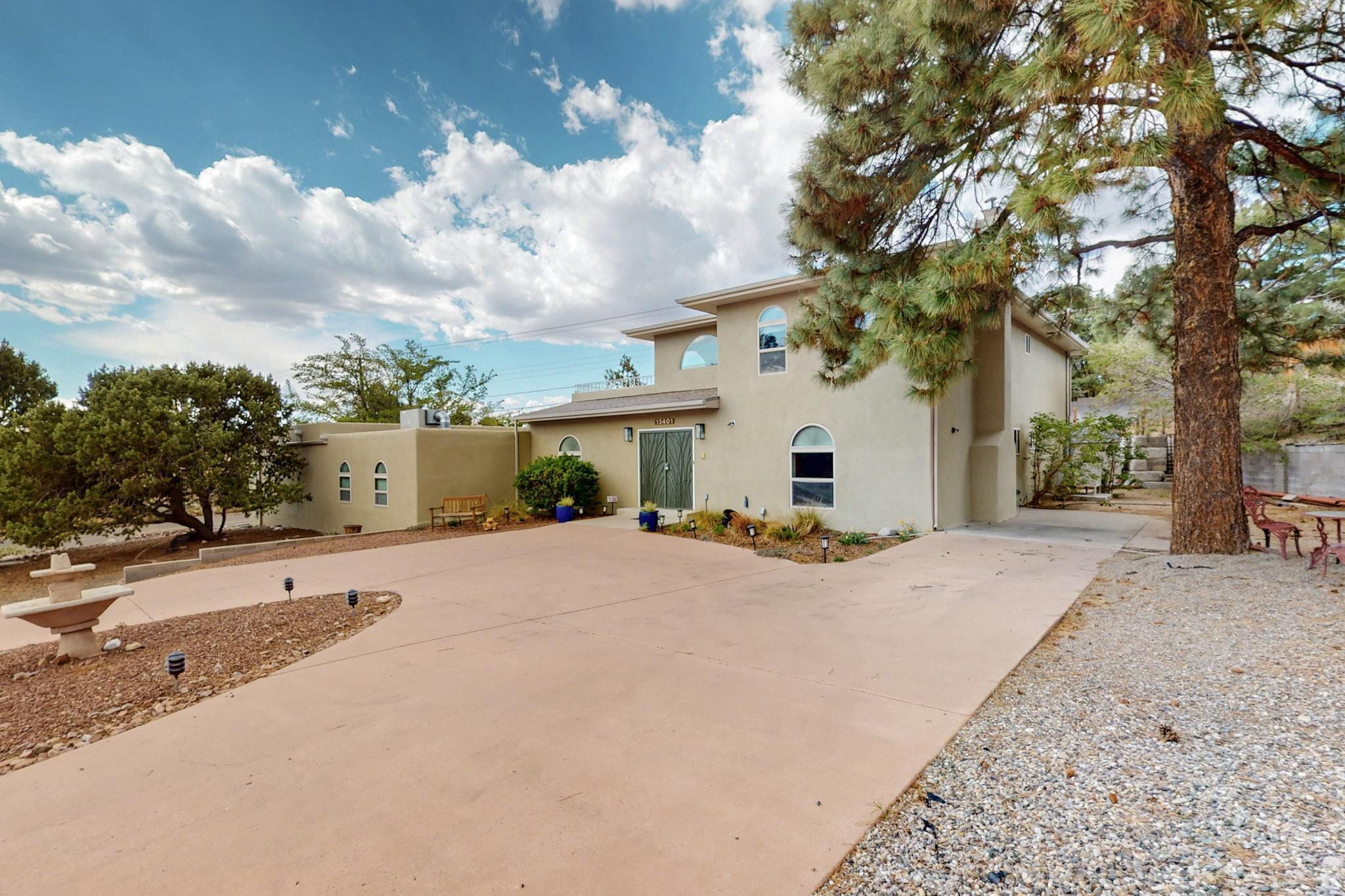 Expansive luxury.  Experience timeless design and modern luxury in this fully remodeled masterpiece on a .40-acre lot. The gourmet kitchen boasts granite counters, pro-grade sinks, and wood flooring. Entertain in the spacious rec room or unwind in the backyard oasis featuring a refinished pool, mature landscaping, and room to celebrate. The home includes a main-floor bedroom with 3/4 bath, a private in-law suite with its own laundry and a dry sauna, plus a second full-size laundry upstairs. Recent upgrades include stucco (2025), high-efficiency boiler (2023), 4 new evaporative coolers (2024), and more. This move-in ready home is a rare blend of quality, comfort, and elegance. Hot tub hookup available outside.