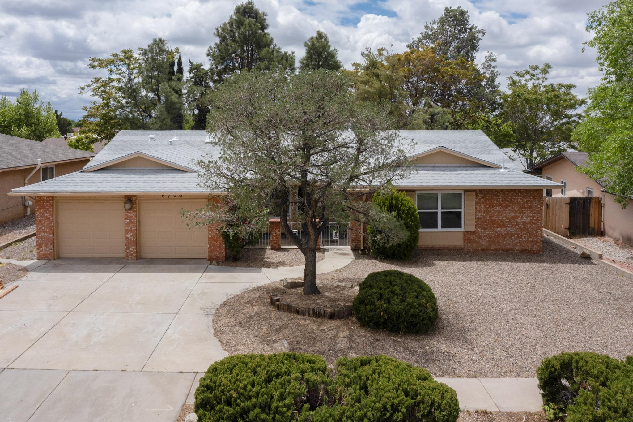 Conveniently located in desirable Albuquerque Acres, this beautiful single level 4-bedroom home has an inviting curb appeal and is a Must-See! The living room, with its comfy fireplace and built-in shelving, is the heart of the home. It serves as the mainstay of the open concept area. The home's many new features include interior paint, six panel doors and new carpet in all bedrooms. The kitchen features newer cabinets, granite tops and new GE stainless steel gas range, dishwasher, and microwave. Both baths are updated and include stylish vanities with granite and solid surface counters and earth tone tile details. The home also includes refrigerated air, a finished garage, and new wood fencing in the rear yard. Take a look today! Owner is a licensed NM real estate broker.