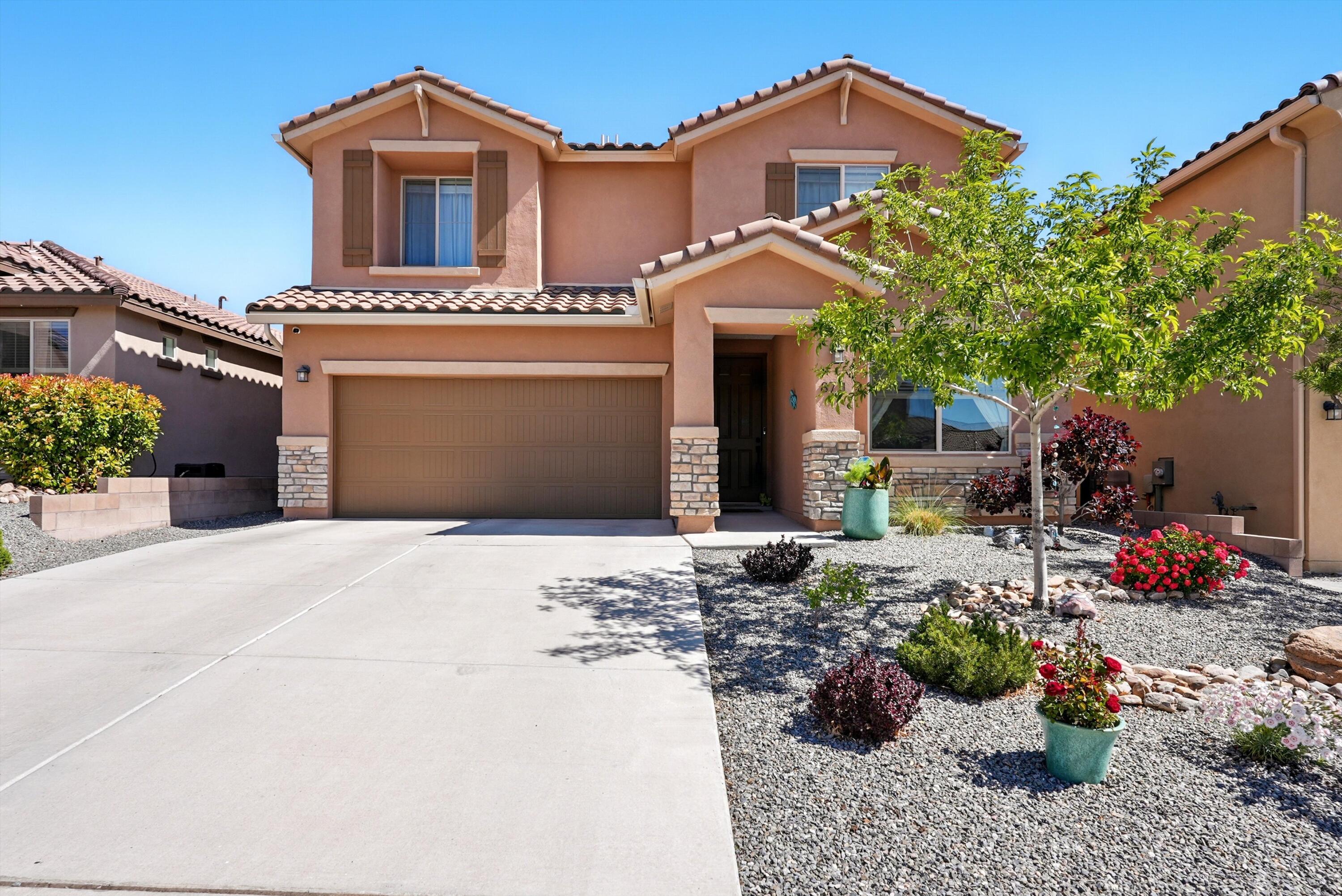Located in a desirable NW Albuquerque neighborhood, this beautifully crafted 3-bed, 3-bath home with loft & mountain views blends comfort, style, & energy efficiency. Enjoy a chef's kitchen featuring a huge island, granite/quartz countertops, upgraded cabinetry, & a Whirlpool gas cooktop. The spacious living room boasts a cozy fireplace & extended concrete for outdoor living. Premium upgrades include newer carpet with deluxe pad, $7K custom closet shelving, instant hot water, whole-house ventilation, a 2-tier car charging station, & a security system with cameras. Landscaping includes turf, a full irrigation system, gutters, & a tree set to reach 20 ft. Faux wood blinds, custom curtain rods, upgraded lighting, & French doors add the perfect finishing touches.