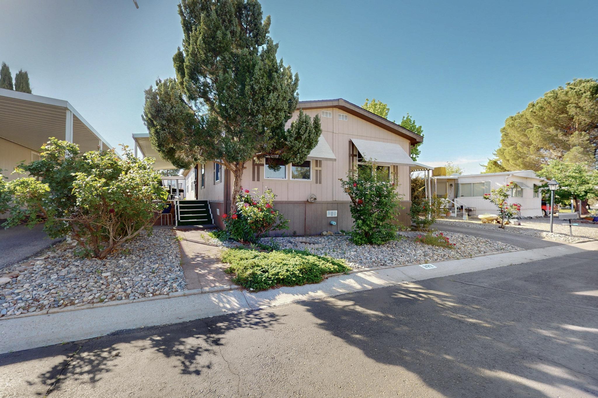 You're going to love living in Albuquerque Meadows, a sought after active 55+ community in the heart of Albuquerque with amenities like a pool, clubhouse, parks, and even a pickleball court! The neighborhood is filled with engaged, friendly neighbors who wave when you pass in the street. The home has a wonderfully renovated, versatile floorplan with newer flooring, appliances, a remodeled kitchen and both remodeled bathrooms. The covered front porch allows you to enjoy the amazing New Mexico evenings. With refrigerated air conditioning and forced air heating, you'll live in comfort year-round.