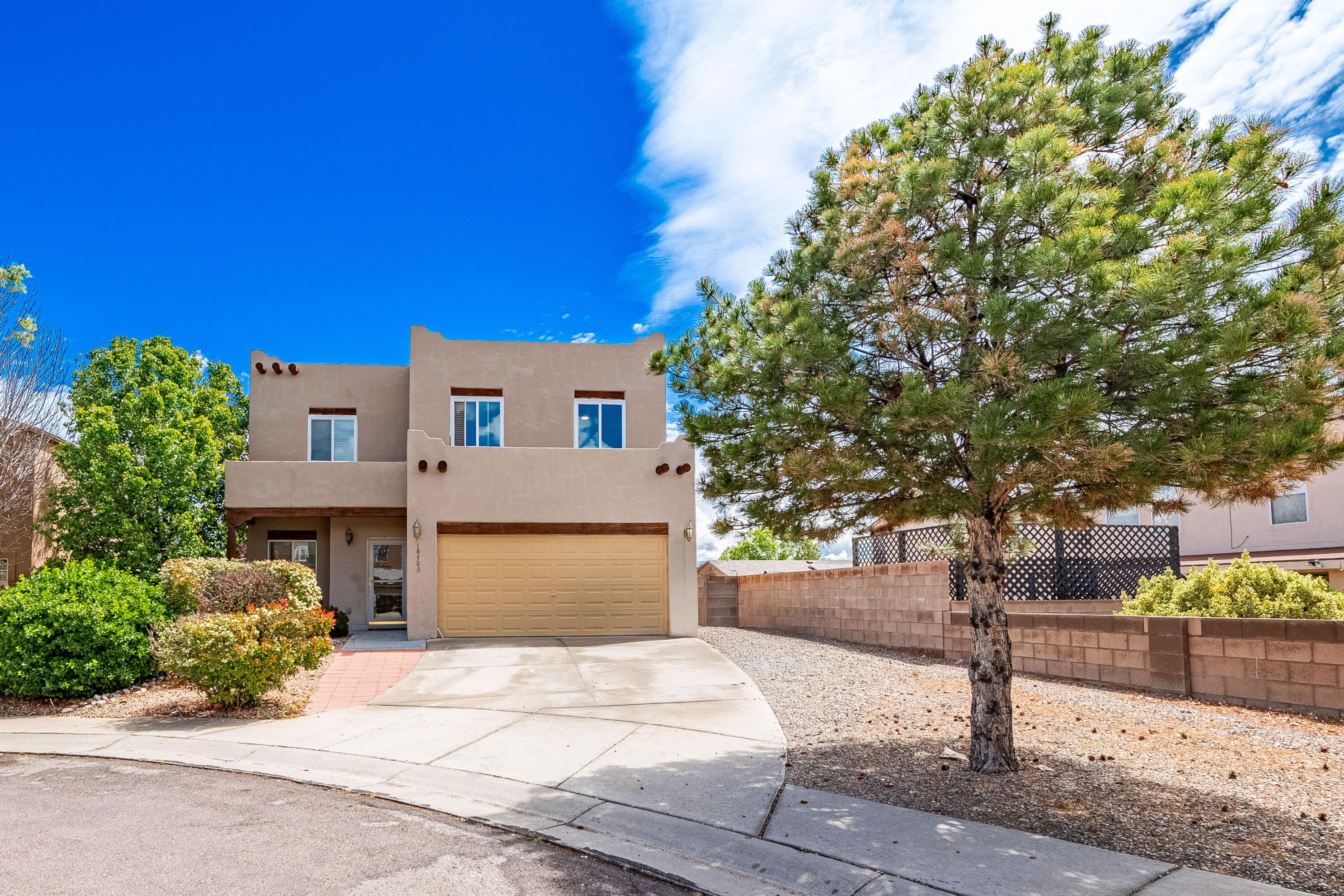 Welcome to 10500 Trieste Ct NW, nestled in a cul-de-sac within the sought-after Ventana Ranch community. This spacious 5-bedroom, 3-bathroom home offers a versatile layout with tile, carpet, and vinyl flooring throughout. Enjoy the expansive walled backyard - perfect for outdoor relaxation and entertaining. With ample space for family and guests, this home is ready for its new owners to make it their own. Don't miss this opportunity to settle into a great neighborhood close to parks, schools, and amenities.