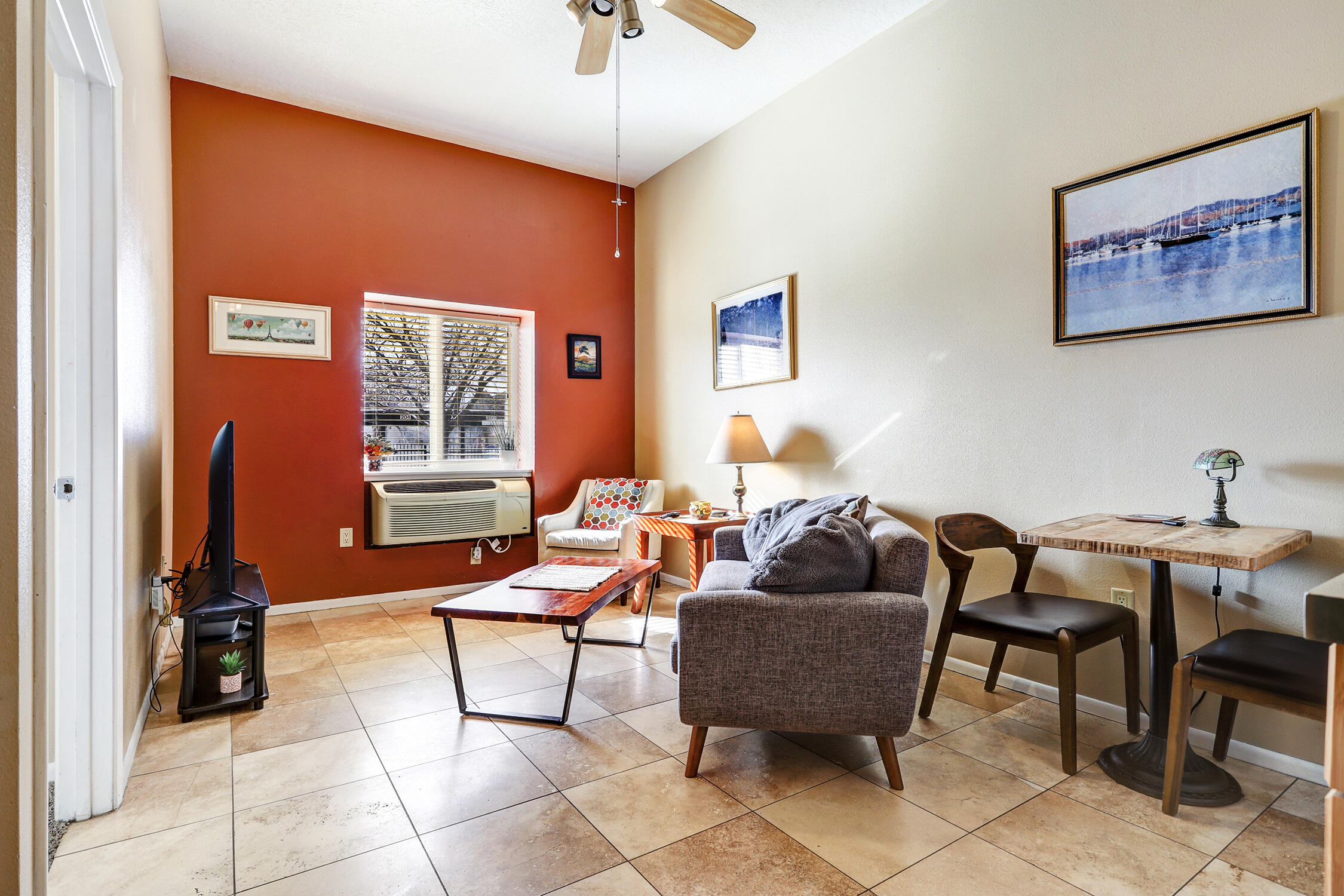 Affordable and Adorable Nob Hill 1 bedroom ground floor condo in a gated 10 unit complex. This unit has a great use of space with kitchen, dining & living all comfortably designed. It feels larger with raised ceiling. Granite counters in the kitchen with maple cabinets, pantry and travertine tile. New mini split in '24 gives you refrigerated ac and heat. HOA covers building insurance, water sewer, and trash, and exterior maintenance. Each unit has a carport and a storage unit in the basement. Community laundry room with a 3/4 bathroom are also located in the basement. BBQ grill located in the back for residence use. Building roof replaced in '24. Easy access to all Nob Hill has to offer.