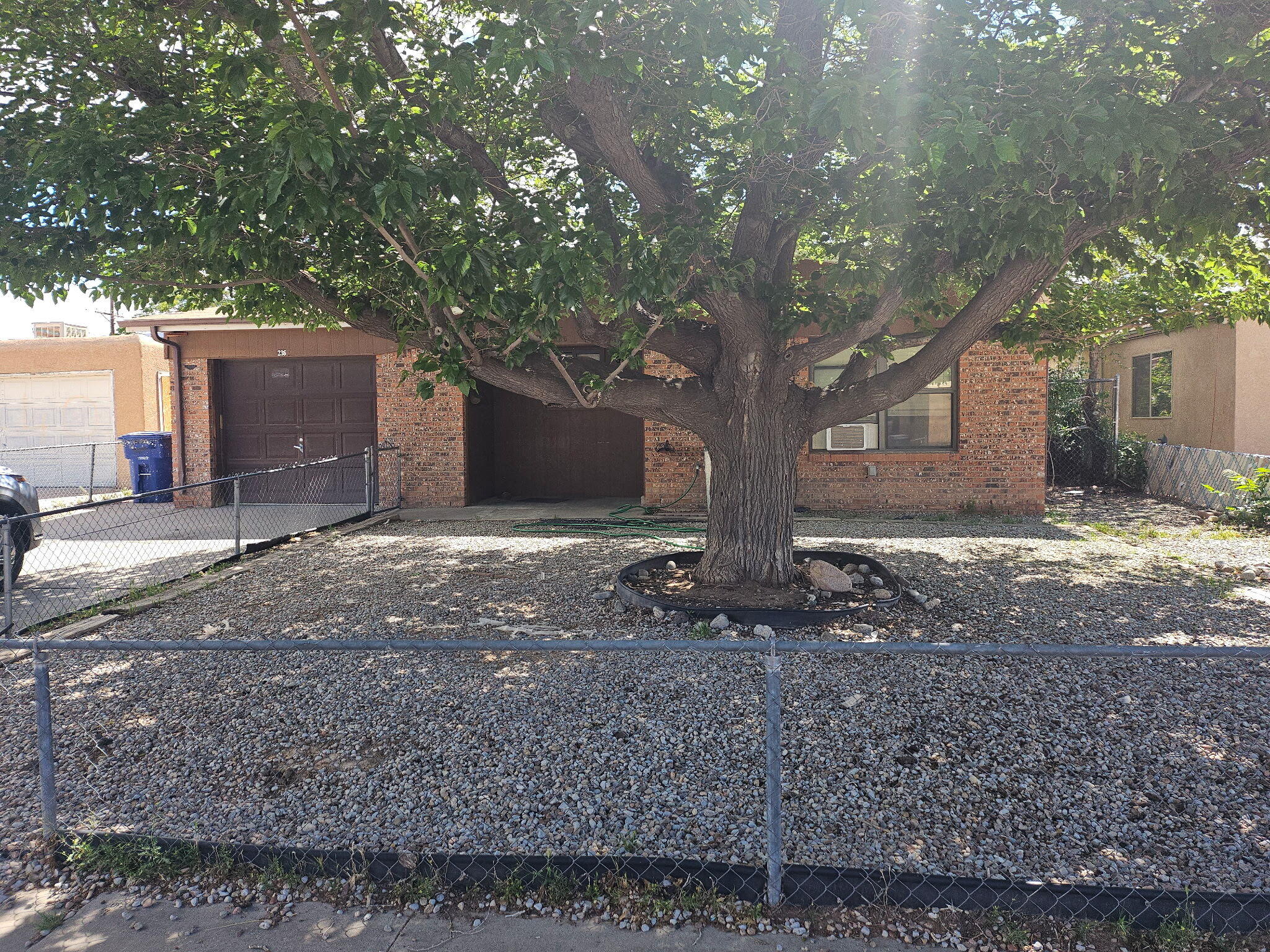 INVESTMENT PROPERTY. Selling the property as-is. Beautiful tile flooring throughout. Chain link dog run in large backyard. One car garage. pitched roof. needs quick sale.