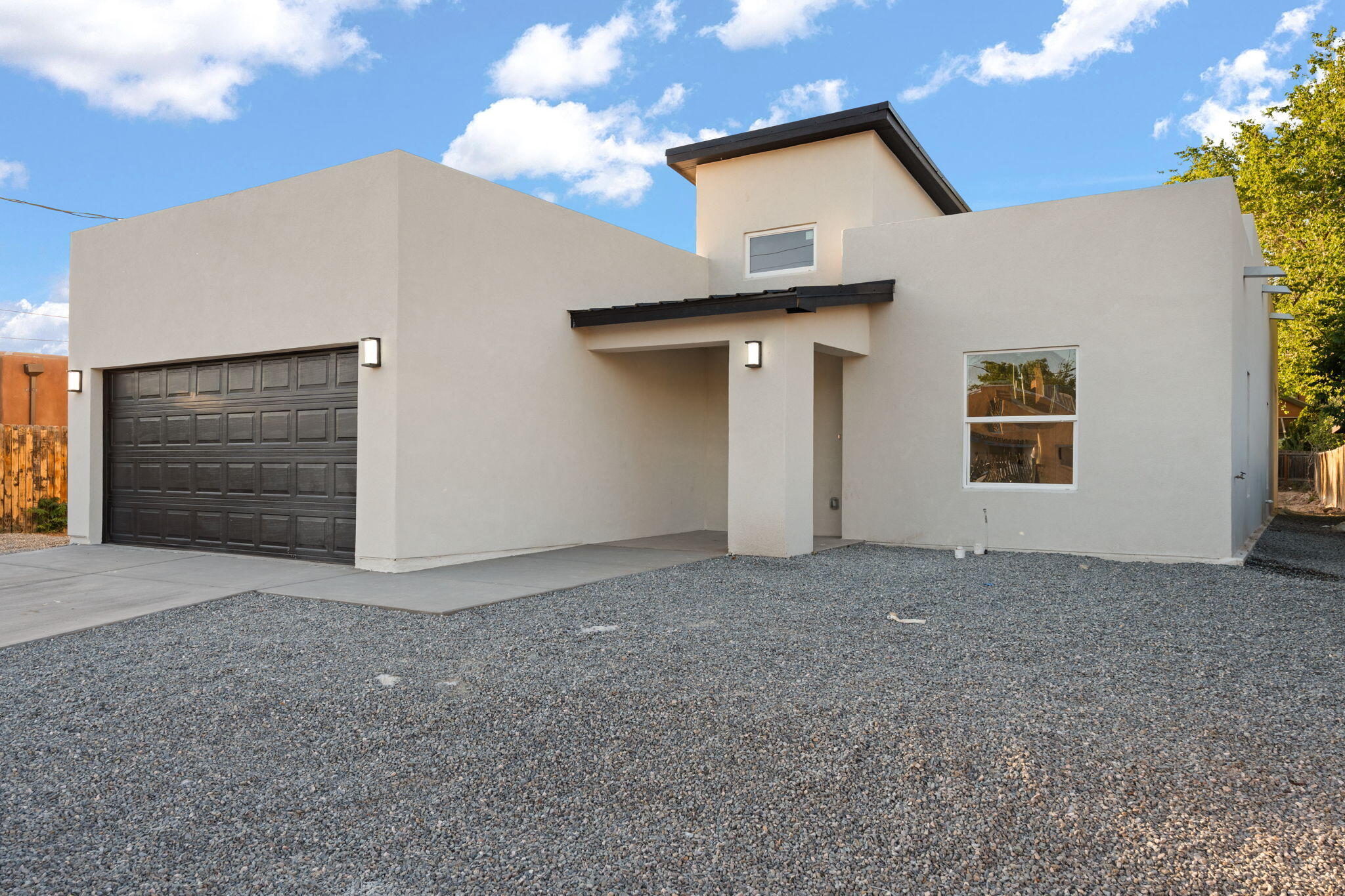 Brand new modern home with massive backyard, covered patio, and development potential! This newly constructed 3-bedroom, 2-bathroom home offers 1,607 sq ft of thoughtfully designed living space with high ceilings, an open-concept kitchen, a spacious pantry, and durable vinyl flooring throughout the main areas. The luxurious primary suite features two walk-in closets, dual vanities, a soaking tub, and a tiled walk-in shower. Step outside to a large covered back patio, perfect for entertaining or relaxing. The oversized lot offers endless opportunities, build a second home, add a workshop, or create your dream backyard. Attached 2-car garage and large driveway for added parking. No HOA and conveniently located near city amenities. A rare opportunity with room to grow or invest!