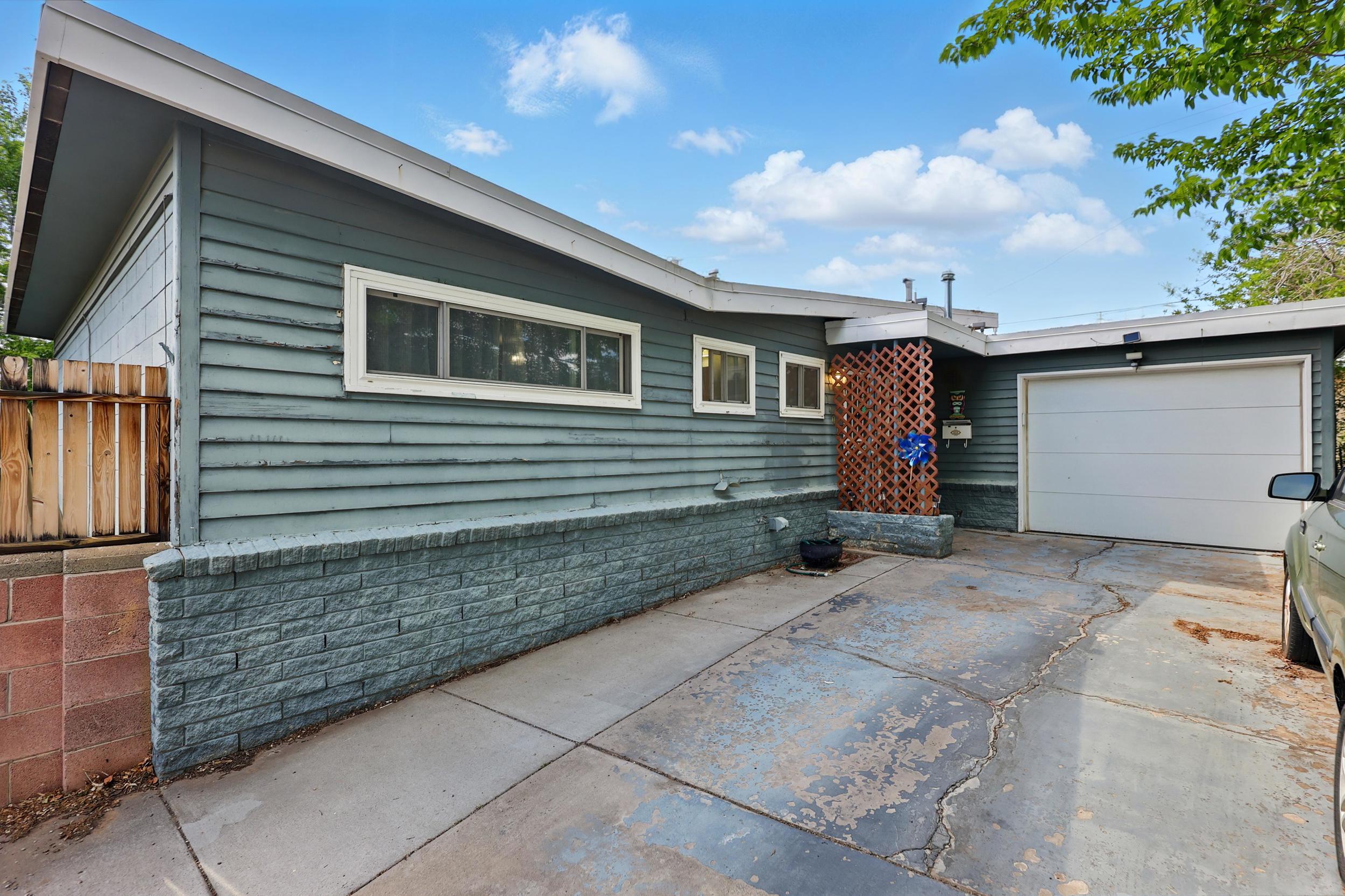 Welcome to this four-bedroom, two-bath home located in the highly sought-after NE Heights neighborhood. The inviting floor plan features an open living area with a cozy wood-burning fireplace. The kitchen is equipped with granite countertops and offers plenty of space for cooking and entertaining. The bedrooms are generously sized. Step outside to a spacious backyard, perfect for relaxing, gardening, or hosting gatherings. With its prime location close to schools, parks, shopping, and dining, this home offers the perfect blend of comfort, style, and convenience. Don't miss it!