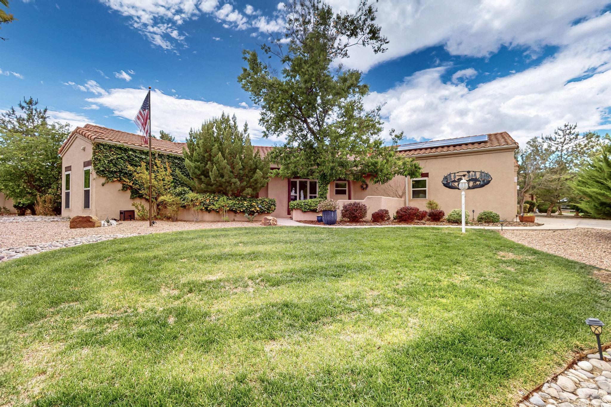 Spacious corner lot home in an exquisite neighborhood, featuring a covered patio plus retractable awning, a courtyard and convenient interior floor plan with 4 main-floor bedrooms, 2 in each wing of the home.  There's one bonus room above the garage that could be an additional bedroom or ample craft space, with access to attic storage areas.  Nearly every window has a view of peaceful greenery.  The oversized 3 car garage has storage and a sink.  Solar panels will keep your expenses in check!  Refrigerated air unit replaced 2019, Furnace ~2020, Water heater ~2022, Water softener added ~2022.  Come see this exceptional home today!