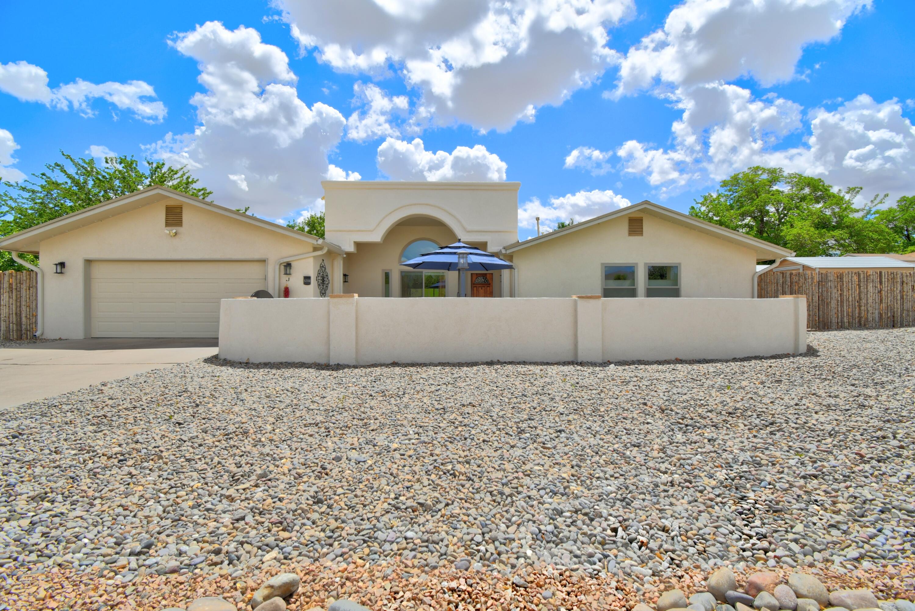 Discover luxury living in this fully renovated ranch-style home, perfectly situated on the 14th Green of Paradise Golf Course. Enjoy 2,604 square feet of open-concept living, featuring a cozy kiva fireplace and updated flooring throughout. The gourmet kitchen is a chef's dream, while the spa-like bathrooms offer a serene retreat. A 2-car garage and side yards with full backyard access provide convenience and space. Relax in the private courtyard, ideal for Balloon Fiesta views, or take in the breathtaking golf course vistas - perfect for New Mexico sunsets. This home boasts modern upgrades including the stucco, windows, plumbing, electrical, gutters, appliances, and refrigerated air for year-round comfort. The only thing missing is you!