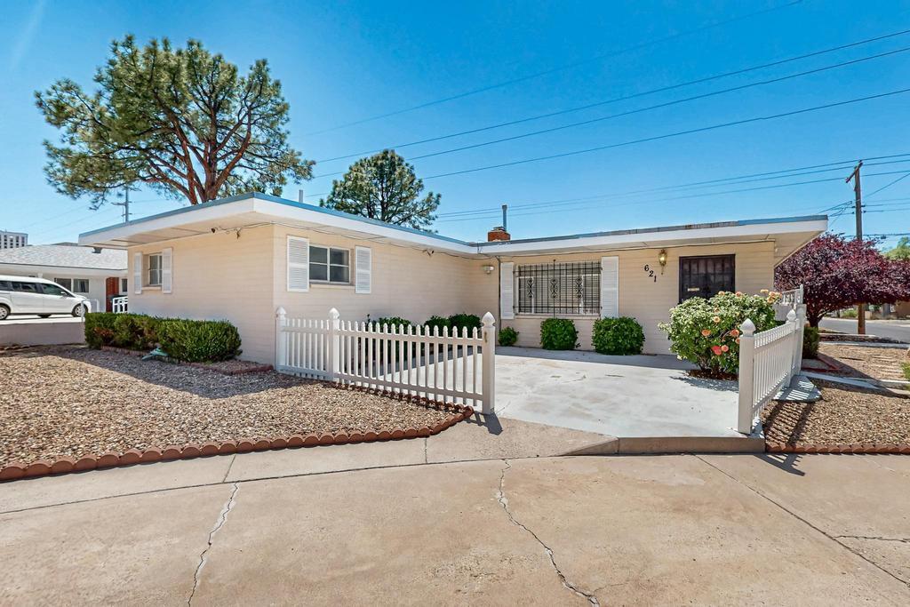Single story 3 bedroom, 2 bath home awaiting new owner! Pride of ownership inside & out! Freshly painted w/ tile throughout! Living room has gas log fireplace & built in shelving! Primary bedroom has updated shower, double sink vanity & ample cabinetry! Secondary bedrooms have center light fixtures & nice size closets. Kitchen/dining flow nicely together. New owner is sure to enjoy the private back yard w/ covered patio & the front courtyard entry. Amenities include; single car detached garage w/ TPO Roof (May'25), Swamp Cooler (May '25), exterior paint touch ups (May '25), updated tile flooring. Security cameras, fridge & dryer convey with acceptable offer! Conveniently located near Nob Hill with easy access to UNM, base, shopping, eateries and interstate! Make this beauty your very own!