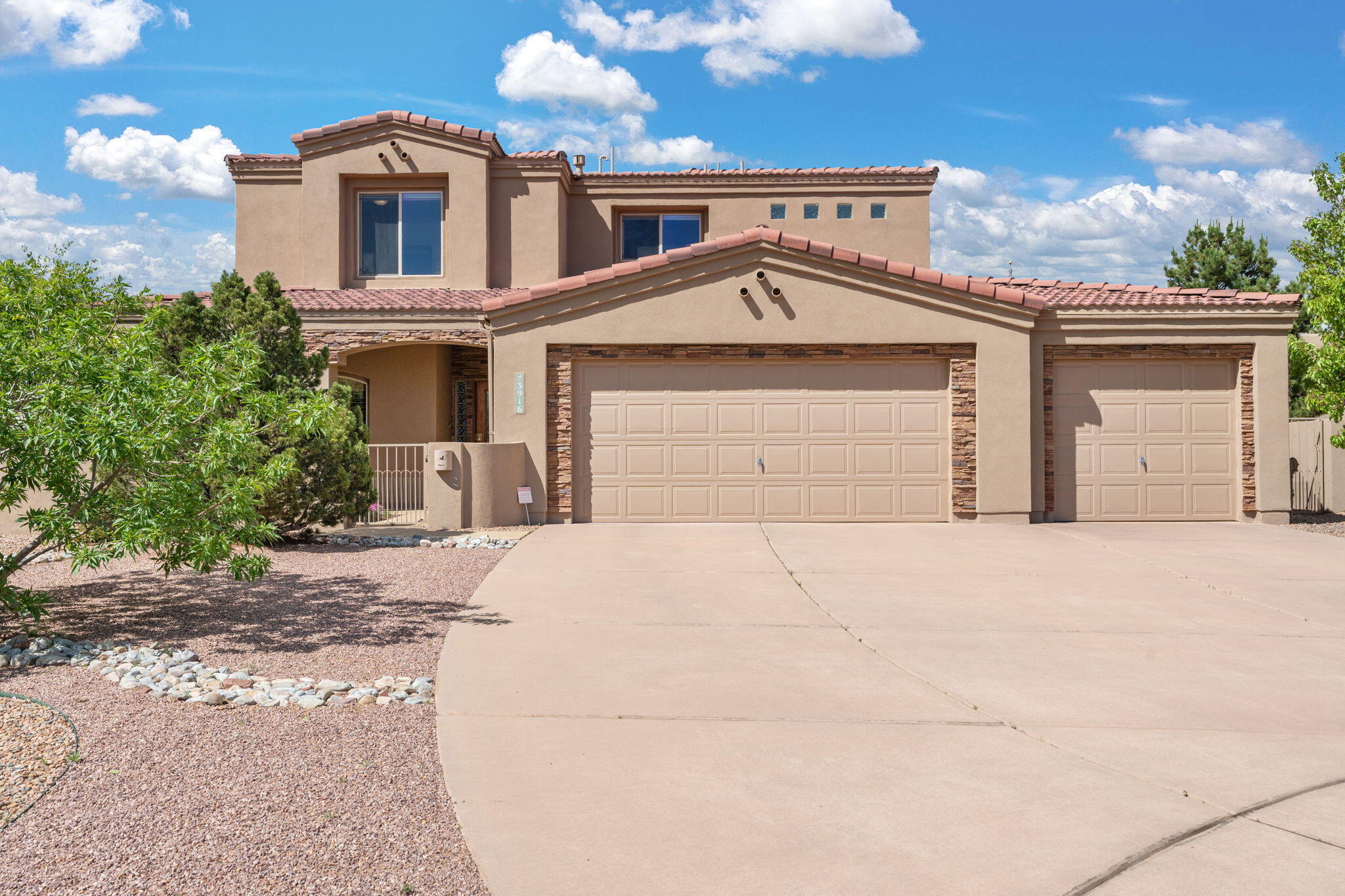 Perched on a fully landscaped bluff lot in Oxbow, this home offers panoramic views of the Sandias, Bosque, and city lights. Designed to maximize its setting, it features an open-concept layout, hardwood floors, and a stunning outdoor entertaining area with a fireplace. All four bedrooms are located upstairs, including a primary suite with a private balcony that offers the best bluff views in Albuquerque. Enjoy easy access to Oxbow trails, the Rio Grande, and cultural hubs like Old Town, museums, and restaurants. This is elevated living--where nature, serenity, and convenience meet.