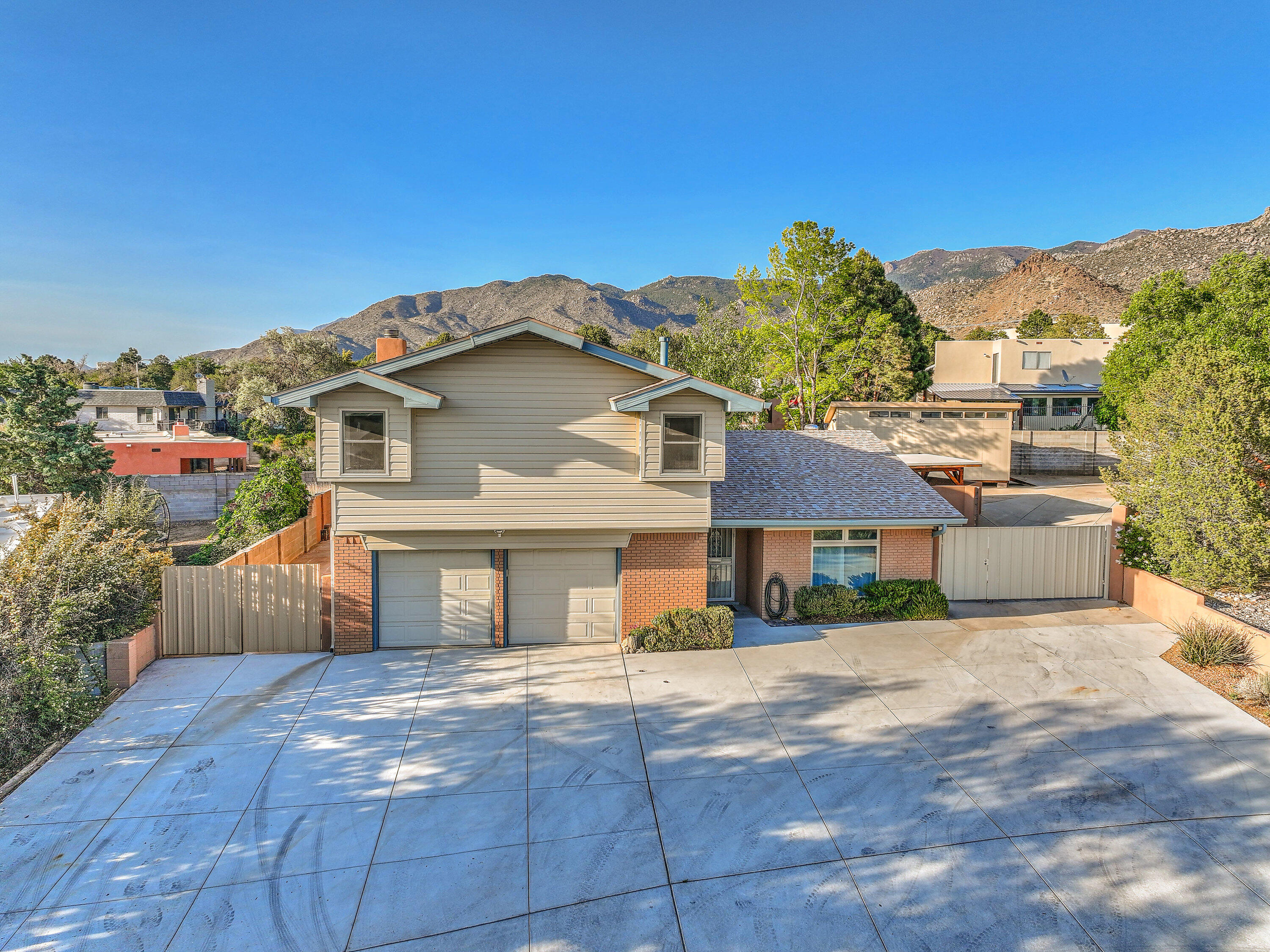 Remodeled with backyard access, workshops, and close to the trails, what more could you want in a house! Chef's will delight in the kitchen with the Bertazzoni double oven gas range, stainless steel appliances, granite counter tops, and soft close drawers. Downstairs enjoy two living spaces with luxury vinyl plank flooring, large fireplace, and a half bath. Upstairs step into the spacious primary suite with a sitting room, walk in closet, granite counter tops, water closet, and tile shower with built in shelf. The additional two bedrooms have great views and ample closet space. Enjoy the upstairs laundry room that is also a study area or craft room! Backyard access for all of your toys plus two workshops and storage sheds. Plus it has refrigerated AC and a new roof! This home has it all!