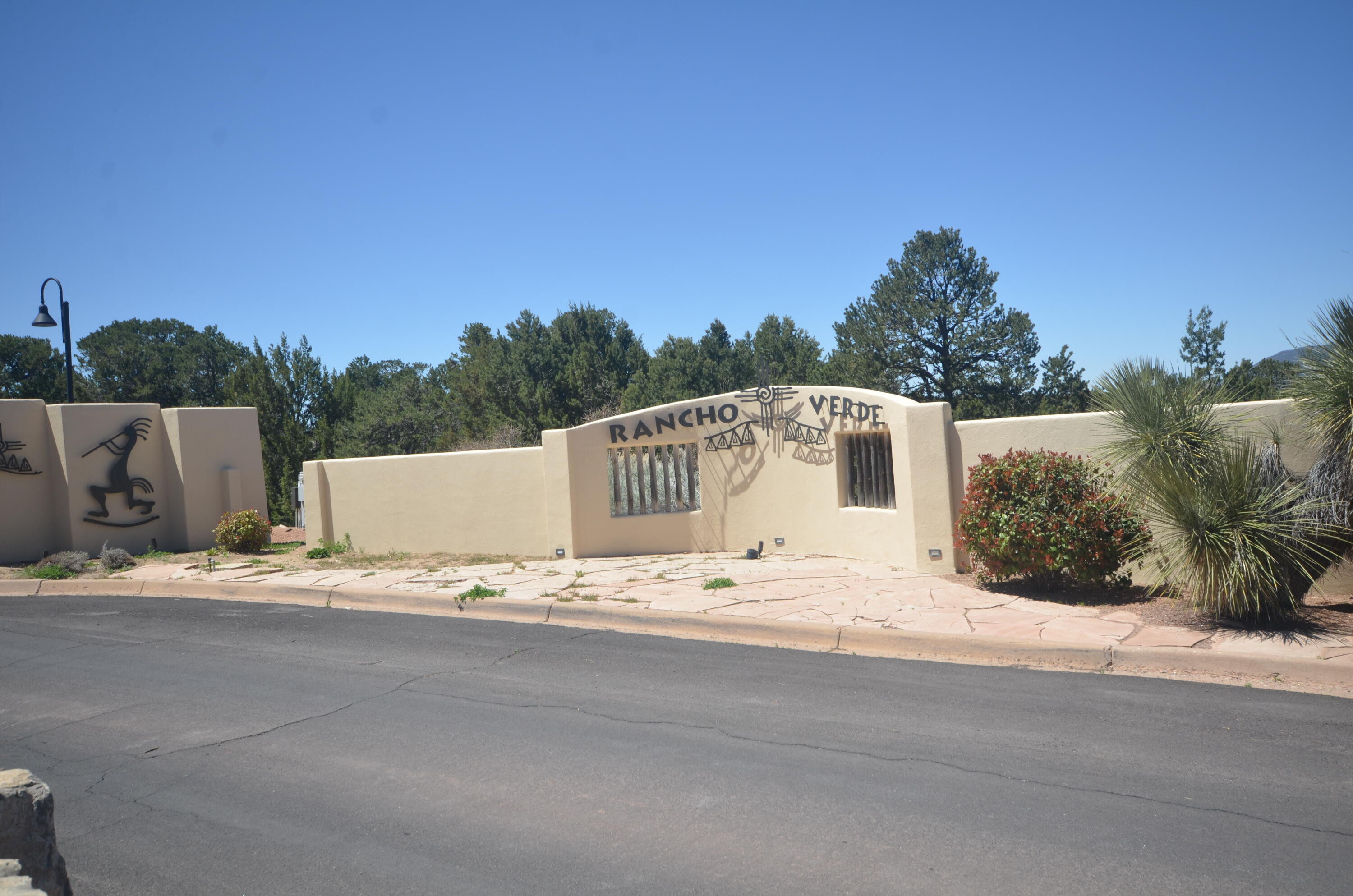 Fantastic 1.37 acre lot located in the prestigious subd of Rancho Verde in Tijeras.  Just 16 miles east of Albuquerque. If you're dreaming of a little peace & quiet without being totally isolated, this is it. This beautiful lot gives you the best of both worlds. You get that wonderful sense of privacy & space, think gorgeous views, gently sloping SE facing land perfect for building w/ lovely Pinion & Juniper trees. Location of the building envelope allows the potential for privacy and valley/mountain views. Located on a cul-de-sac lot with all paved roads to the property. Entranosa water membership included. Electric and water at the property line. 26 Rancho Verde, the neighboring lot is available to purchase as either package for a total of 2.93 acres or individual lot.