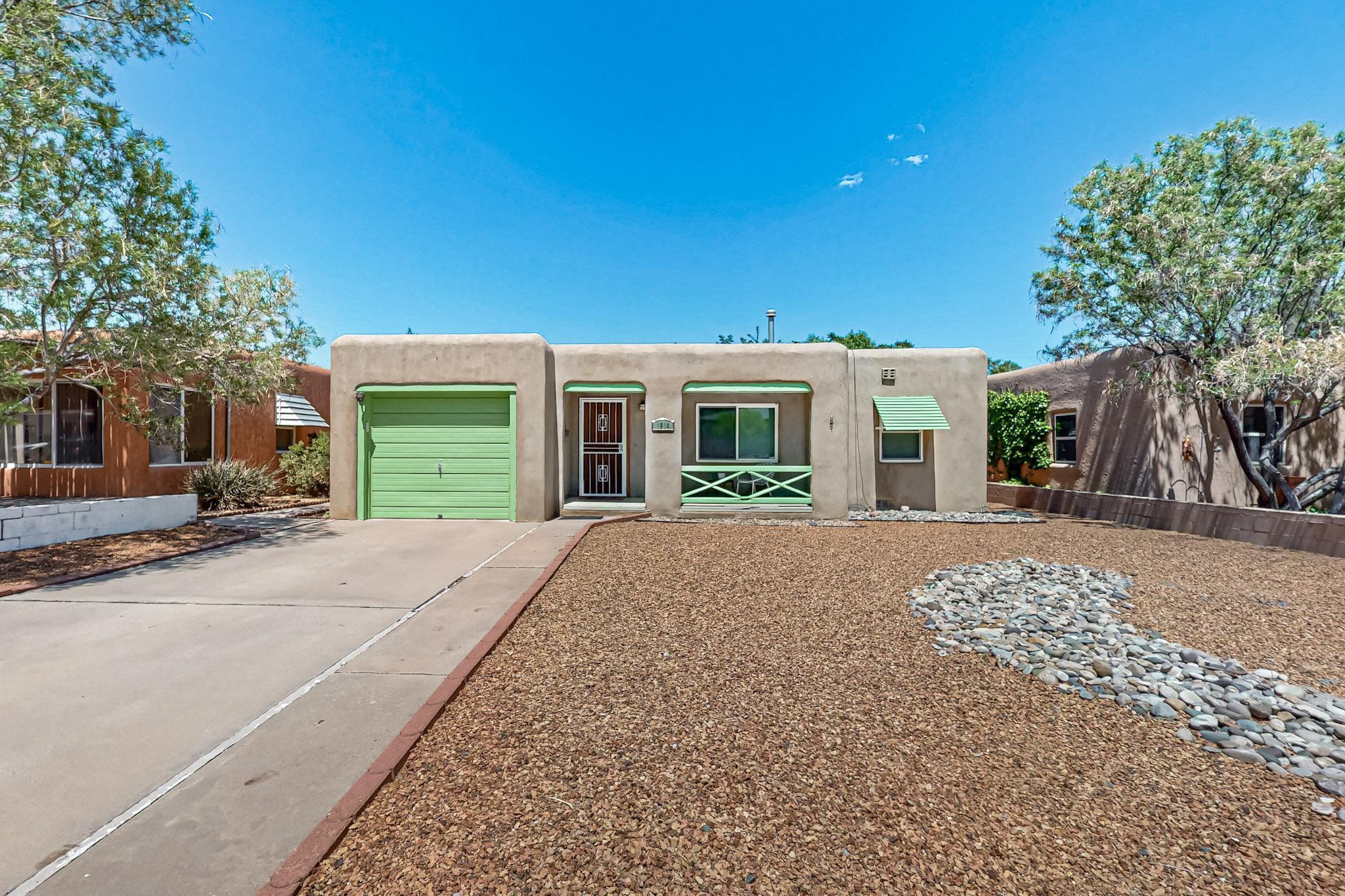 Tucked in the heart of UNM Ridgecrest, this lovingly maintained home blends vintage warmth with thoughtful updates. Original hardwood floors, coved ceilings, and soft natural light create timeless character. The remodeled kitchen offers solid-surface counters, stainless appliances, cast iron sink, Saltillo tile, and a spacious pantry. French doors open to a serene backyard with $10K in landscaping and a shaded patio that invites you to linger. Enjoy a newer MasterCool system, tankless water heater, vinyl windows, and excellent storage in the garage and laundry. Come see where comfort, charm, and character blend in perfect harmony to create a place you'll feel at home.