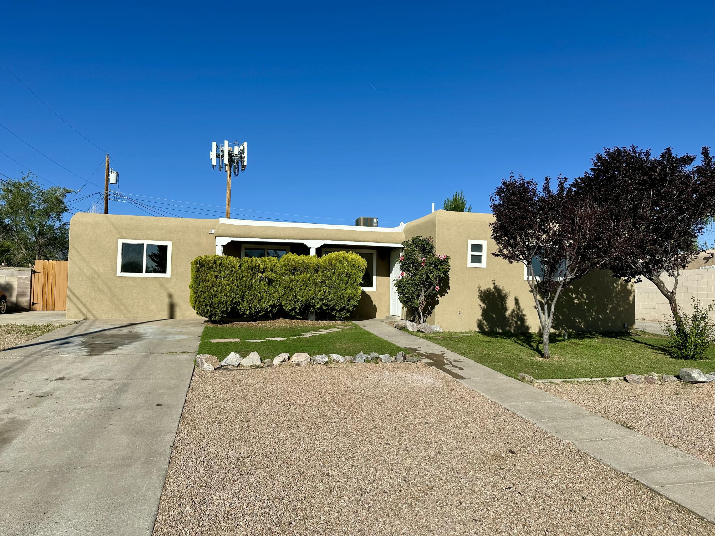 North East Heights Single story five bed, two bath home with backyard access possible. The home boasts new kitchen cabinets, solid surface countertops, new LVP flooring and new carpet throughout. New tile surrounds in the bathroom shower. New Two-tone paint. And two living areas. One with a fireplace and wet bar.