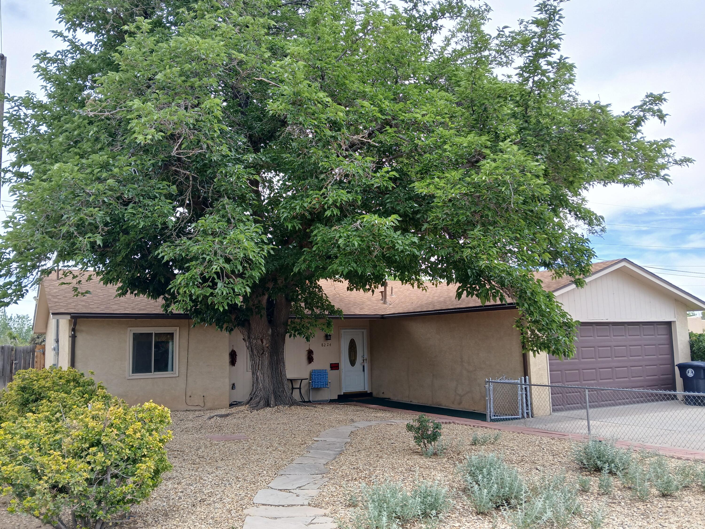 Welcome to this charming home in a Prime Location! It boasts numerous recent upgrades, providing peace of mind and value.  In 2022 the water heater, roof and furnace were replaced.  In 2023 the home was converted to AC, the electrical panel was upgraded, new laminate flooring and gutters were added. 2025 updates include fresh paint, new guest bath vanity and landscaping updates.This beautifully updated 3-bedroom, 2-bathroom home has a wood burning fireplace in the spacious family room. Ideally located close to schools, work, shopping, restaurants and medical offices, for everyday conveniences.
