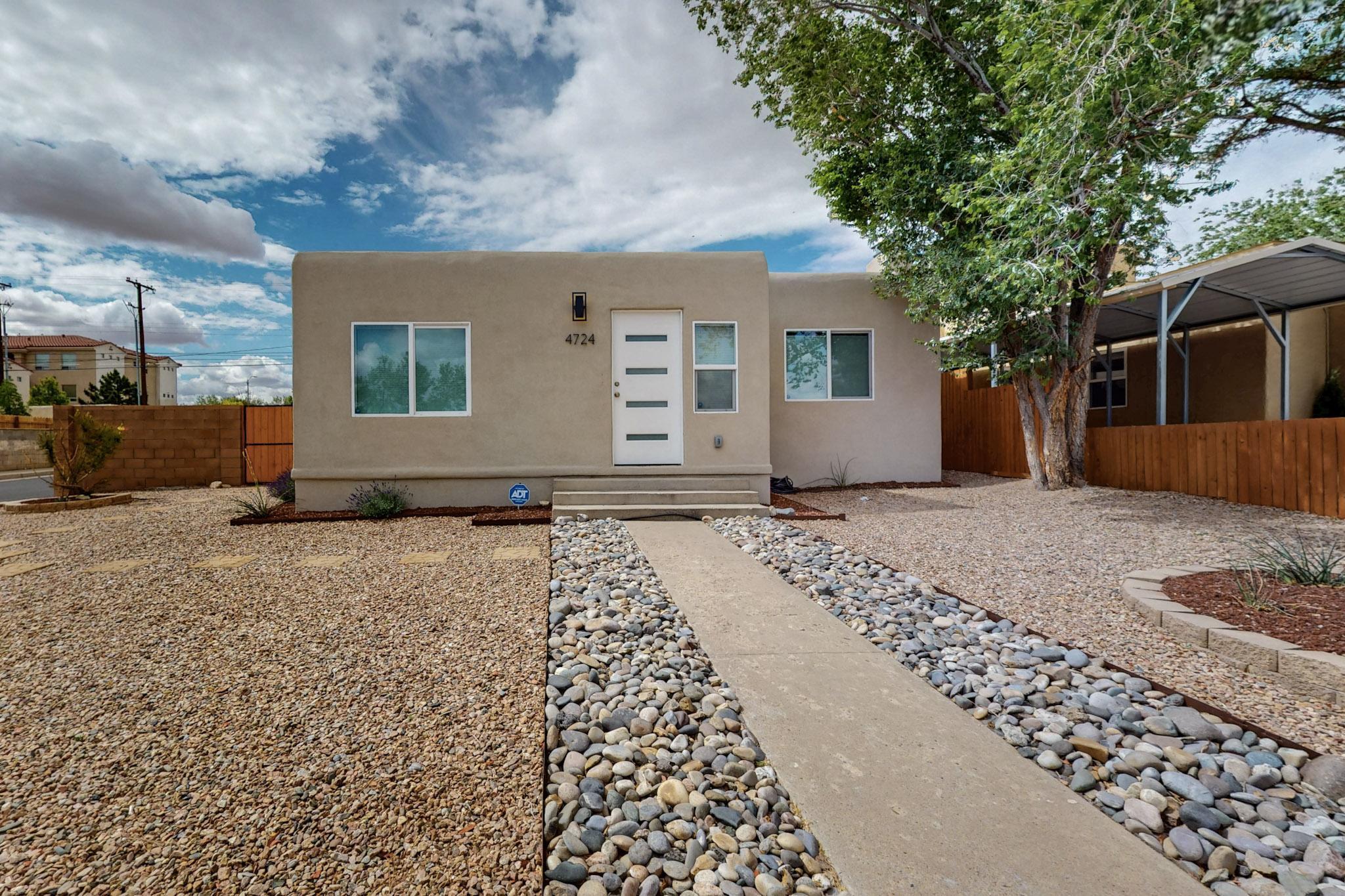 Embrace the Ridgecrest Lifestyle! Imagine waking up to breathtaking mountain views in your beautifully updated 3-bedroom haven. Original hardwood floors whisper tales of the past, while modern comforts like a new TPO roof, energy-efficient windows, and a refrigerated air/combo unit ensure effortless living. The stylish kitchen, boasting sleek quartz countertops and included appliances, is perfect for culinary adventures. Step outside to your private, fully walled backyard oasis with easy-care drip irrigation. Enjoy added peace of mind with an installed ADT security system and the convenience of two brand-new garage doors. This isn't just a house; it's your next chapter.