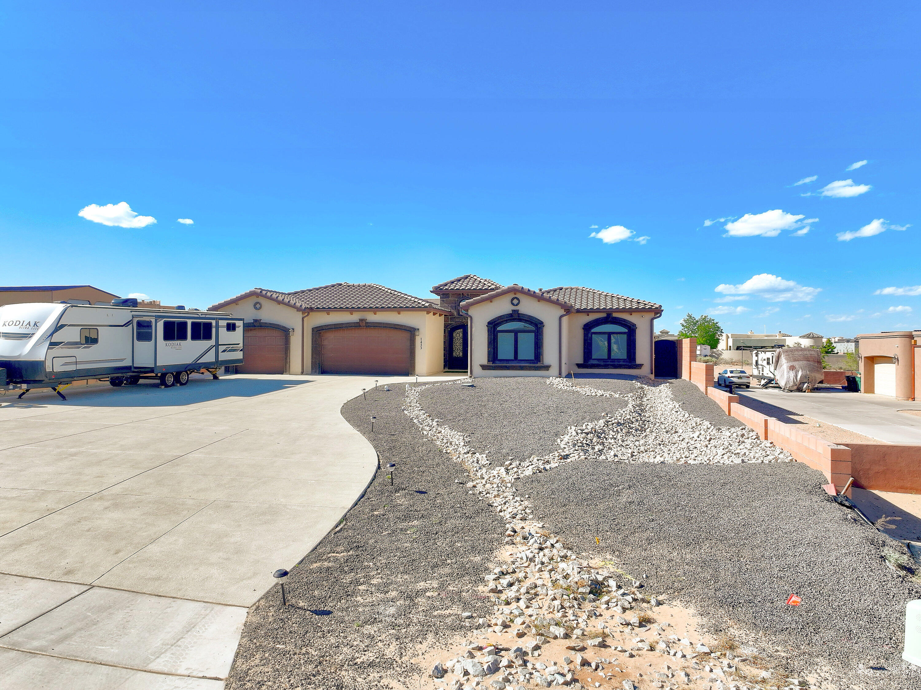 Beautiful single story home on 1/2 acre with city services. Chef's delight kitchen with custom Castillo cabinets,Granite counters, Monogram high end SS appliances to include 6 burner stove, pot filler, Sub Zero fridge, and butlers pantry. Kitchen is open to the great room with high ceilings and fireplace. All the bedrooms are generous sized. Theater designed for movie nights. Relax in the backyard with the sparkling pool, auto cover,outdoor shower, jacuzzi, firepits, outdoor kitchen, fireplace, and view deck. HUGE covered patio!  Fruit trees and tramoline too. Casita has a bedroom, full bath and living area, plumbed for a small kitchen. The Garage is oversized with two large storage rooms,sink and tankless water heaters.