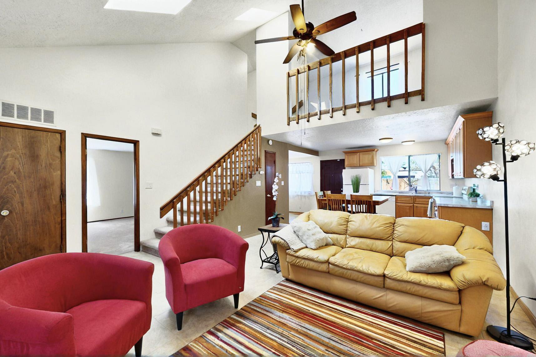 Discover your ABQ Dream Home nestled in a pocket neighborhood in Ladera Heights. This open, spacious townhome, offers 1638 sqft. of charm and an abundance of natural light, thoughtfully designed living spaces, vaulted ceilings, multiple skylights, a cozy fireplace, noteworthy updates, two spacious ensuite bedrooms and a versatile large loft that can serve as a home office, 2nd living area, or guest retreat. Step into the beautifully remodeled kitchen, with new tile, cabinetry and countertops, designed for those who appreciate both style and functionality. Newer carpeting enhances the interior, creating an inviting atmosphere you'll love coming home to. Recent updates set this property apart: new TPO roof in 2020, stucco in 2014, and modernized sewer and water lines, ensuring peace of min