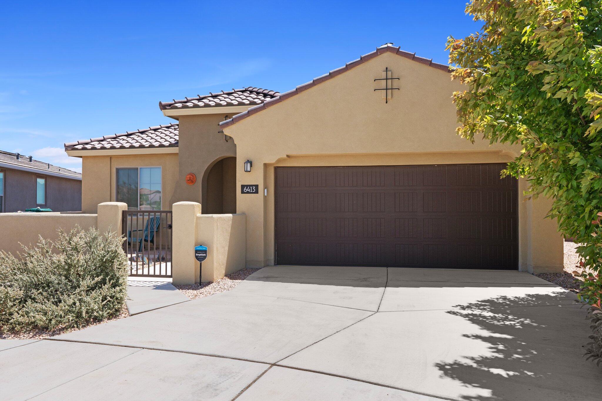 Stunning single story home perched on a rare, elevated lot in the gated section of Mariposa with breathtaking views of the Sandias and city lights.  3 bedroom plus an office & flex space + an extra large garage. Great curb appeal and welcoming courtyard sets the tone.  Inside you're greeted with beautiful ceramic tile & engineered hardwood adding warmth and style. The gourmet kitchen features granite countertops, built in appliances, custom backsplash and lighting.  Open concept layout with massive backdoor sliders that highlight the views from the large backyard patio! Primary suite is extra large with ensuite bathroom including a tiled walk in shower and generous closet. Tile roof, cul de sac, 8' doors, 1/4 acre lot + more!  Access to clubhouse, pools and trails!