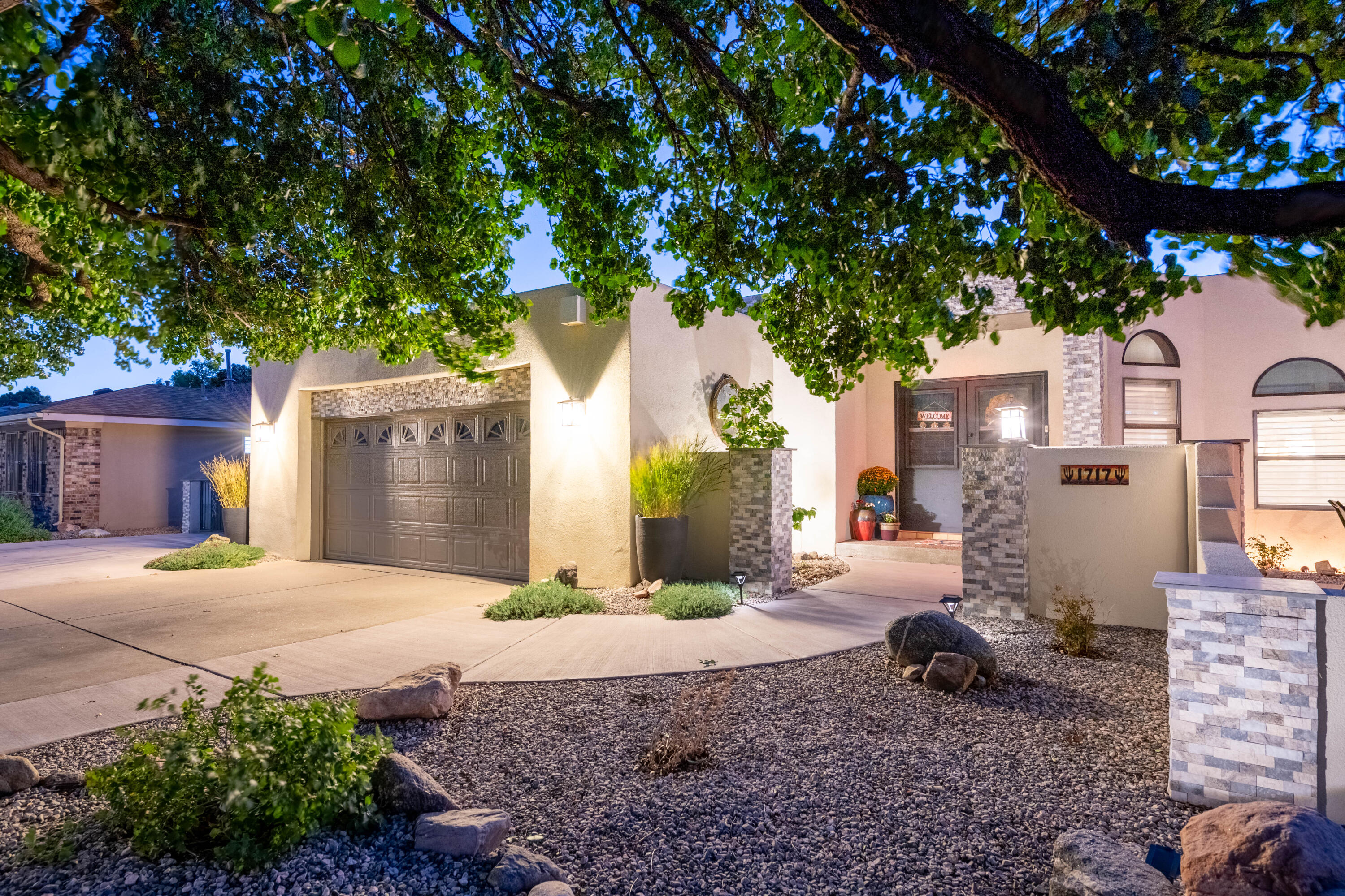 Stunningly remodeled home with upgraded kitchen featuring quartz & granite counters, new cabinets, and appliances. Updated flooring throughout, with heated tile in the spa-like primary bath. Primary Suite includes Roman tub, dual-head shower, and expanded walk-in closet. Guest and half baths fully redone. New interior doors, custom window coverings (some motorized), fresh paint, 2 new FANG furnaces, 2 new A/C units, and a 4-year-old TPO roof. Landscaped front and back yards with irrigation, mature grass, peach & cherry trees, and a front courtyard. Backyard includes Trex deck with spa, pergola, synthetic turf lounge, and a custom 10x12 shed. Oversized garage with shelving, extra RV parking pad, new sidewalk, and passive solar Trombe wall with new trim! Schedule your showing today!