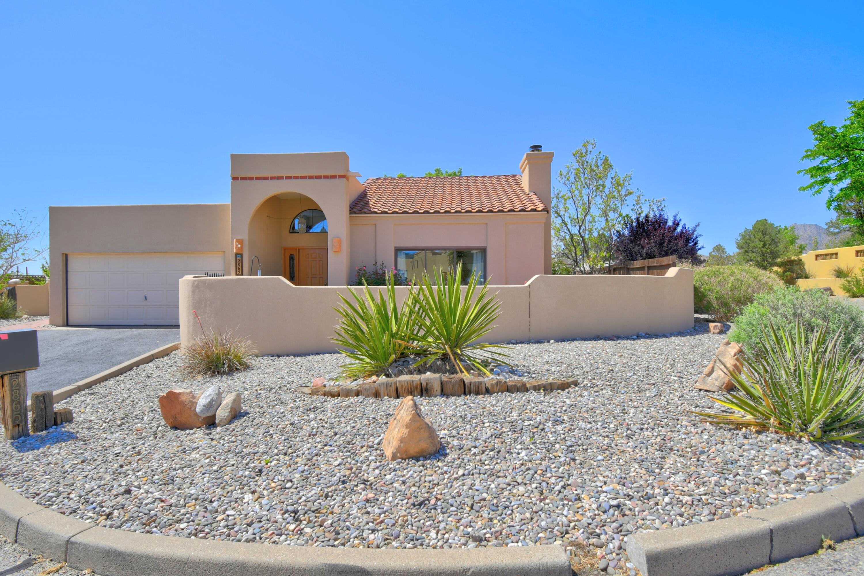 Open house Sunday 5/25 1pm-3pm.  Stunning Single-Level Home with AWESOME City and Mountain VIEWS  located in SANDIA HEIGHTS! This home offers 3 bd/2 full bths, 2 living areas & formal dining. Large windows with gorgeous Views and strategically placed skylights allow natural light to pour in. Enter into a warm and inviting living area with a beautiful wood burning fireplace. The family room adjacent to the kitchen makes entertaining a breeze. Large primary suite with access to a sunroom perfect as a private sitting area, home gym, or art studio. One of many upgrades is the 2018 solar installation, seller owned - offering energy efficiency. Home is enhanced w/smart home features, bringing modern convenience & connectivity into daily living. 2 car garage. Close to hiking/biking trails.