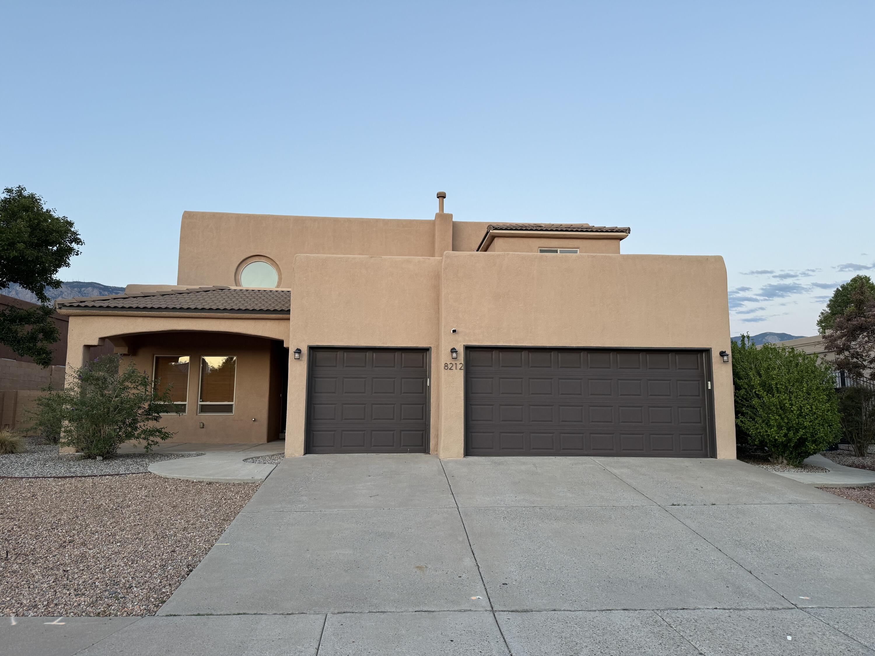 This stunning Home is located in the heart of one of ABQ's most desirable neighborhoods! Thoughtfully designed with owned solar, an open floor plan, bamboo flooring, and featuring expansive windows that flood with natural light; offering seamless access to the back patio--perfect for entertaining or enjoying peaceful moments outdoors. The heart of the home, opens beautifully throughout the kitchen, living, and dining areas, creating a bright and inviting atmosphere. The fully finished basement includes a private bathroom, providing ideal space for a guest suite, home office, or media room. Situated perfectly, this home enjoys morning sun and afternoon shade--an amazing setup for energy efficiency and outdoor living. The backyard is a true retreat with lush grass and mature evergreens!