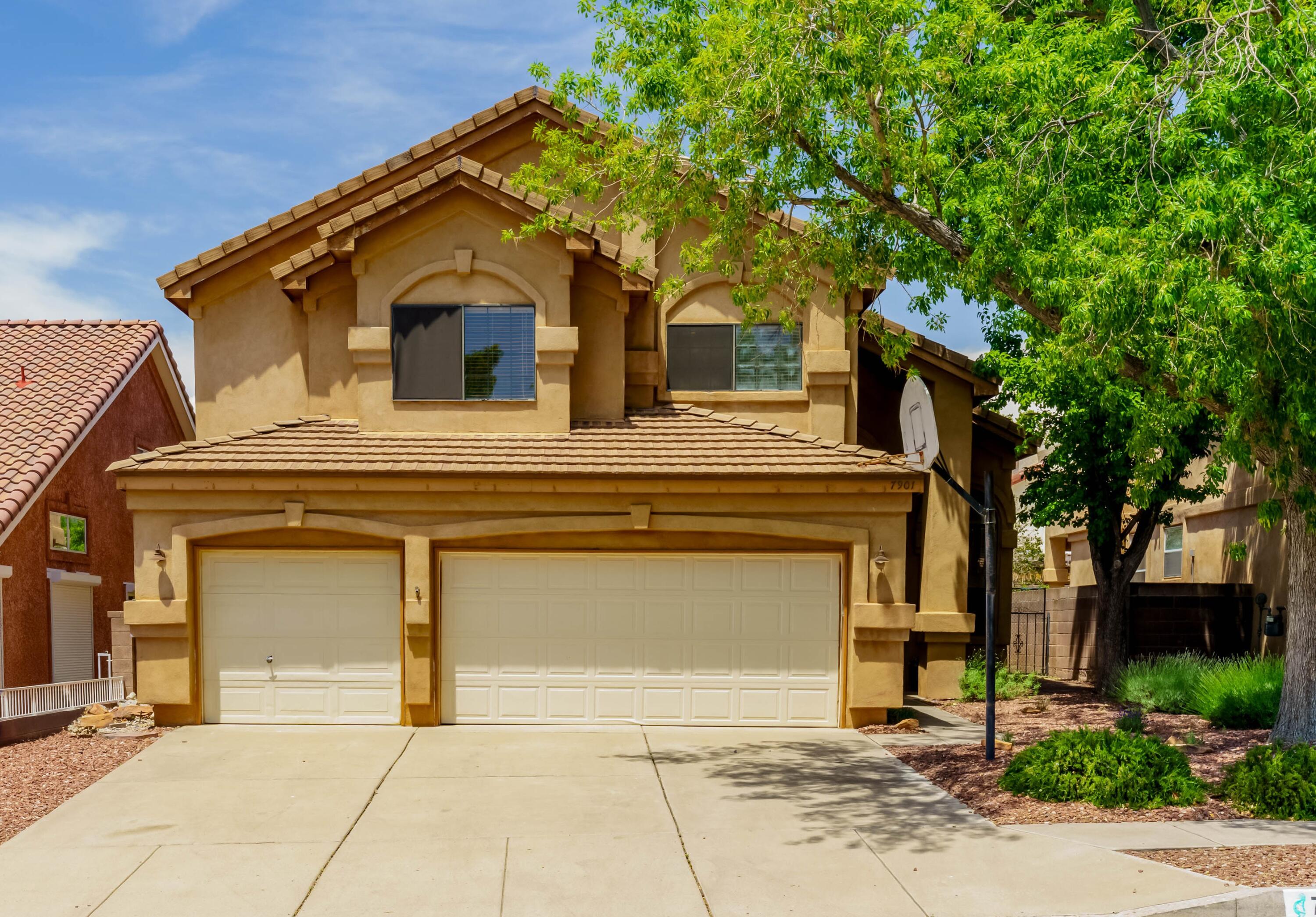 Welcome to this spacious 4-bedroom, 2.5-bath home in the highly sought-after Nor Este Estates, just one block from La Cueva High School & in the Desert Ridge / NorthStar district. Step inside to soaring cathedral ceilings in the formal living room and a dramatic open staircase that sets the tone for this elegant home. The eat-in kitchen features a pantry and flows seamlessly into the inviting family room with a cozy fireplace. The private primary suite offers a large en-suite bathroom with dual vanities, a soaking tub, separate shower, and two walk-in closets. Enjoy mature landscaping and a private backyard ideal for outdoor living. A 3-car garage completes the package. Don't miss this incredible opportunity in one of the Northeast Heights' most desirable neighborhoods
