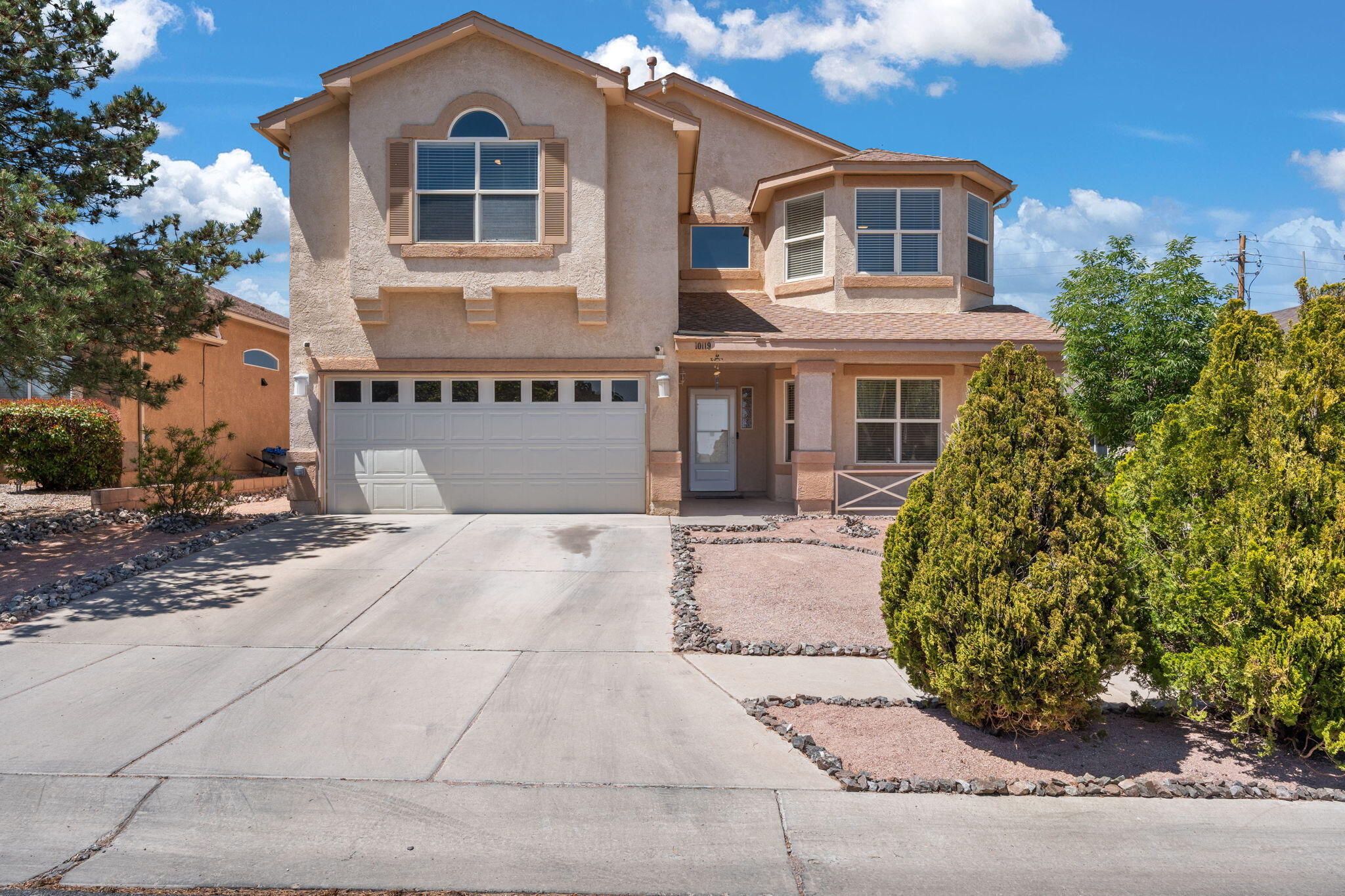 Located in a desirable gated community with quick access to I-25 and I-40, this beautifully updated 4-bed, 3-bath home offers generous living space and stylish upgrades. Enjoy two spacious living areas and a versatile loft perfect for a home office or playroom. The kitchen features a stunning tile backsplash, under-cabinet lighting, and newer flooring throughout. Stay comfortable with refrigerated air, and take advantage of the upgraded electrical panel and EV charging port. The backyard is low-maintenance and includes a dedicated dog run. The oversized primary suite is your private retreat, complete with a spa-like bath, soaking tub, and a large walk-in closet. Schedule your private showing today!! You do not want to miss out!!