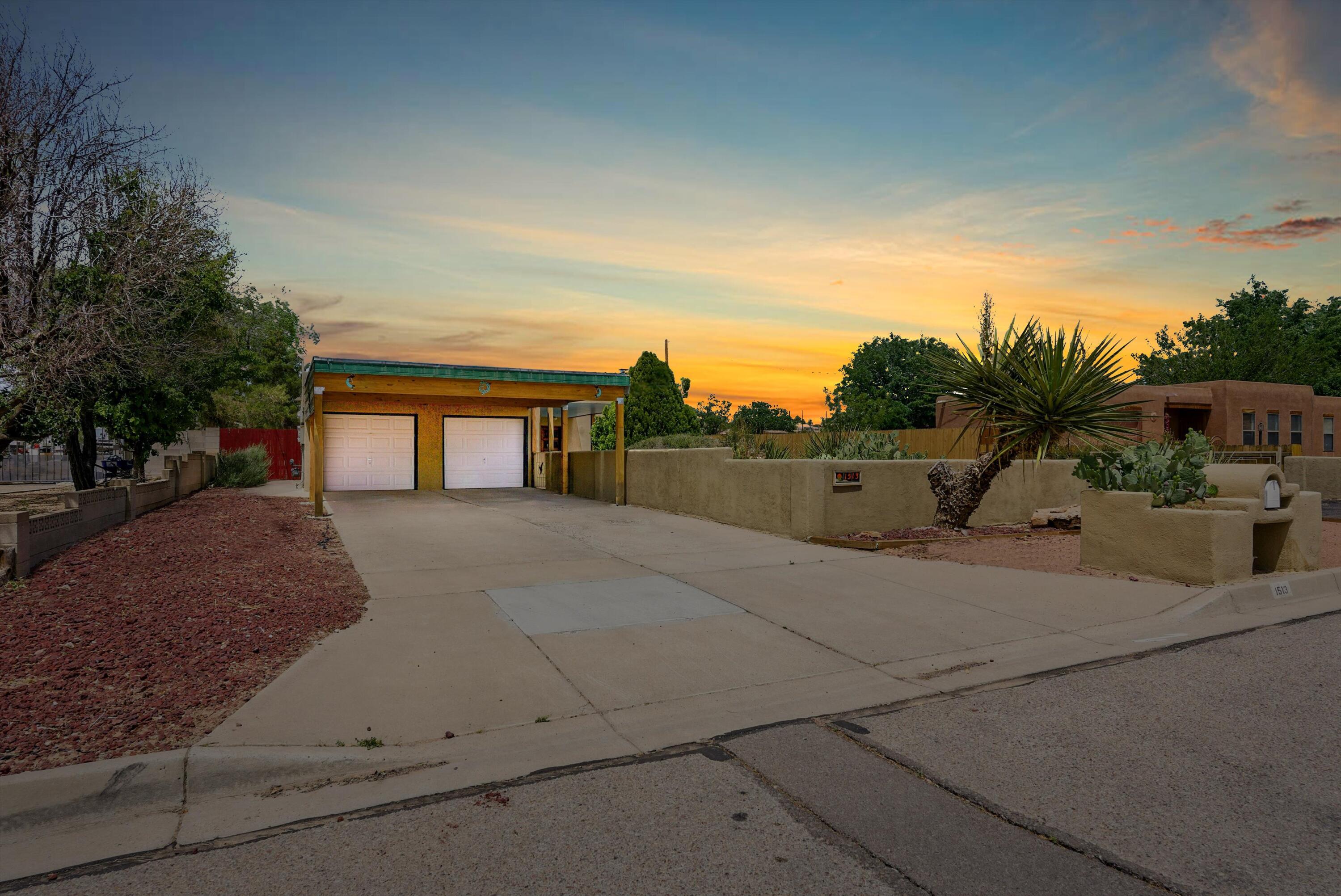 Don't miss this well maintained Rio Rancho gem, located on a half acre lot featuring 3 large  bedrooms, 2 bathrooms, an oversized kitchen and high ceilings throughout the main areas!  The exterior features a 2 car attached garage with a 2 car carport extension, private courtyard and a bonus garage/workshop with over 1100 sq/ft of additional, finished storage space! The yard comes nicely landscaped with both low maintenance SW features as well as fruit and nut trees, drip system and mature rose bushes. Did I mention it has owned solar!?  Come see this home before it's gone...