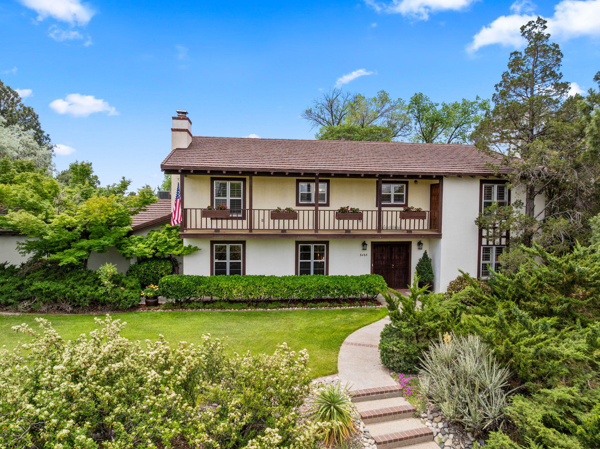 Nestled within a picturesque setting, this residence offers a rare opportunity to create a dream home. The property boasts breathtaking grounds that have received meticulous care over many years, as well as a spacious floor plan featuring; four expansive bedrooms, two full baths + a half-bath, living + family room + formal dining. Spanning over a quarter acre, this home is ideal for large families, with views of the surrounding greenery providing a visually stunning backdrop. The mechanical systems have been rigorously maintained and serviced annually by Davis HVAC, notable updates include; metal roof (approx. 10 yrs old), tankless water heater (approx. 3 yrs old), and storm windows (which insulates and blocks sound) and custom shutters. The home is priced to reflect the need for