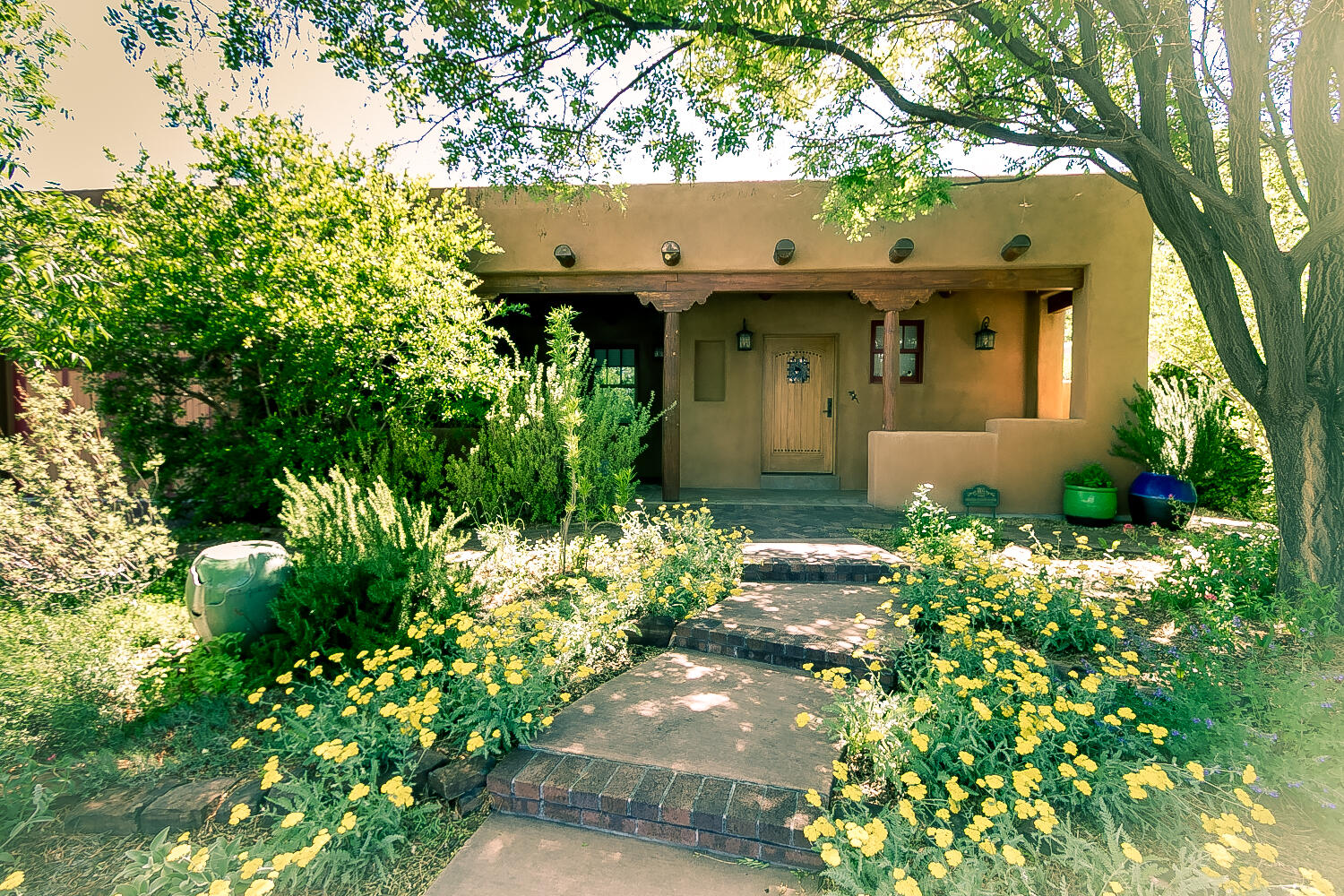 It may be one of the best-engineered homes in the area. A most unique Pueblo-style home in Altura-adjacent Ridge Park! Renovated top-to-bottom side-to-side & front-to-back in 2010. A model of energy efficiency & a showplace of style & taste. Updates, upgrades & amenities include solid oak floors, plaster walls, T&G ceilings, thermal windows, vigas, latillas, corbels, electrical service & plumbing + newer TPO roof & stucco. Three bedrooms includes ''attached casita'' with bed & bath & entered from the back patio. Extraordinary open-concept kitchen w/huge pantry. Beautifully landscaped front & back. Work shed with electric. Wood sauna. Rain catchment system. Dog clean-up area. Two-car tandem garage. Popular mid-city location close to Altura Park, Nob Hill, UNM, Uptown & Downtown.