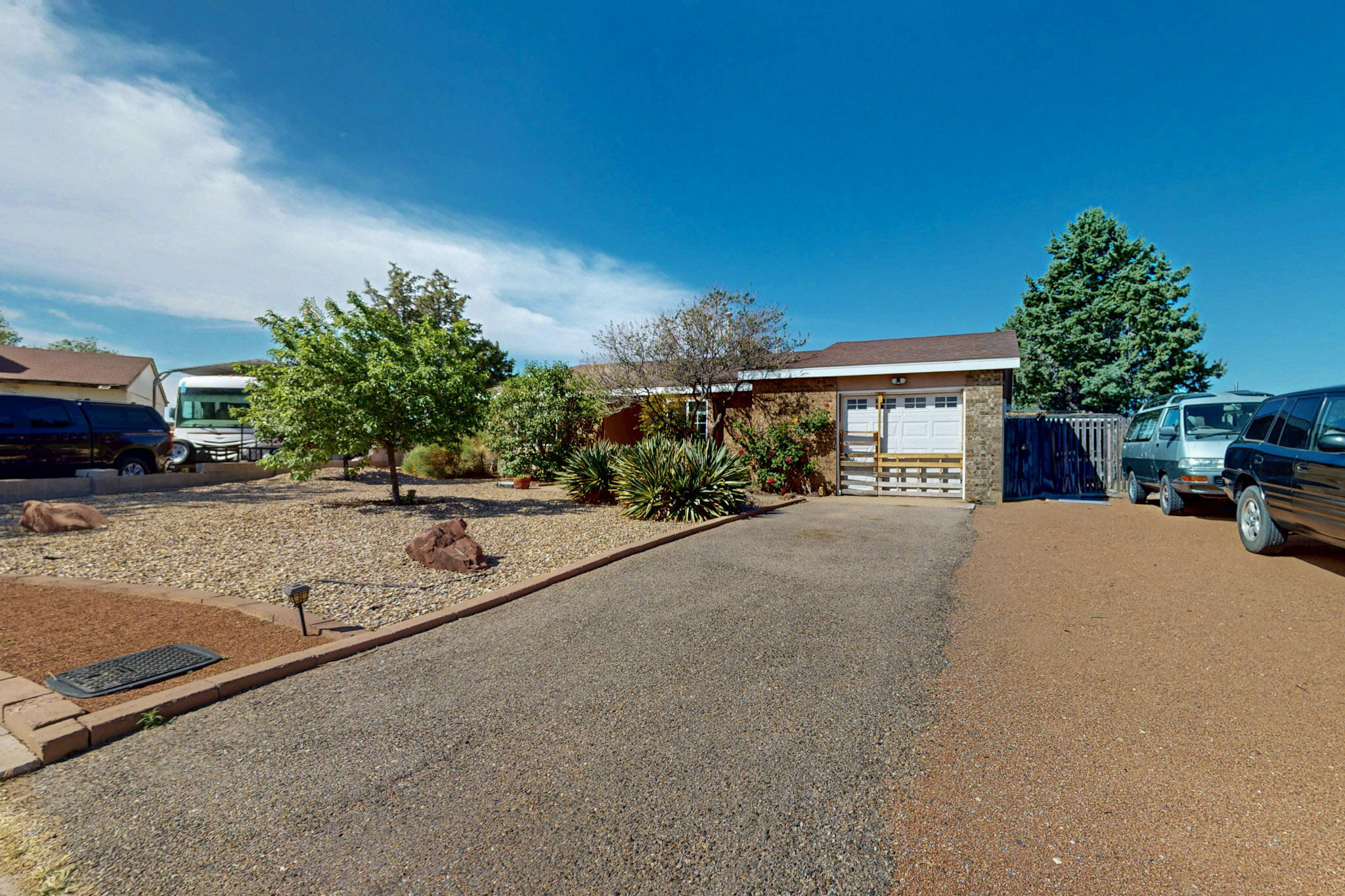 Price reduced on this move in ready home tucked away in a peaceful cul-de-sac! Open, bright floor plan with vaulted ceiling in the great room, 3 bedrooms, 2 bathrooms and ceiling fans throughout. Beautiful windows with deep ledges for plants, art, collections or anything you desire. Enjoy the large primary suite with a sitting area and a large soaking tub with dual shower heads. Great kitchen with gas stove and plenty of shelves and big pantry for storage. Beautifully landscaped backyard that attracts the amazing birds of New Mexico to enjoy while relaxing under the shaded patio. Large bonus outdoor building with so many possibilities from hobby room to a corral for the animal lover!  Location!!! Close to everything from open space, parks, public swimming pool, shopping & hospitals!